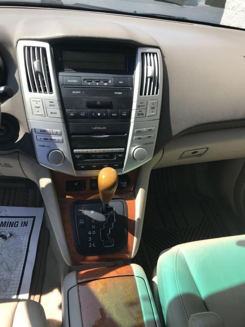 2004 GOLD LEXUS RX330 330 (JTJHA31U640) with an 3.3L engine, Automatic transmission, located at 3100 Covert Avenue, Evansville, IN, 47714, (812) 473-4492, 37.955418, -87.512238 - Photo#5