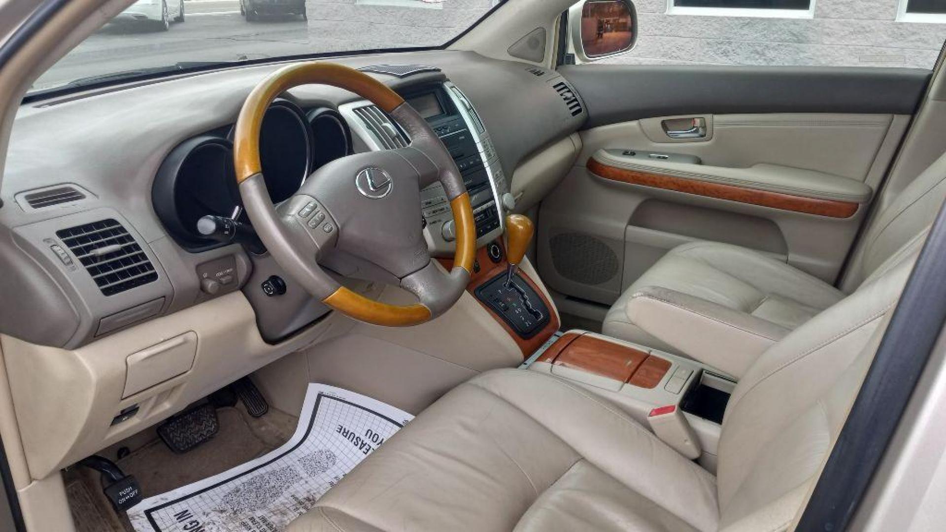 2004 GOLD LEXUS RX330 330 (JTJHA31U640) with an 3.3L engine, Automatic transmission, located at 3100 Covert Avenue, Evansville, IN, 47714, (812) 473-4492, 37.955418, -87.512238 - Photo#11