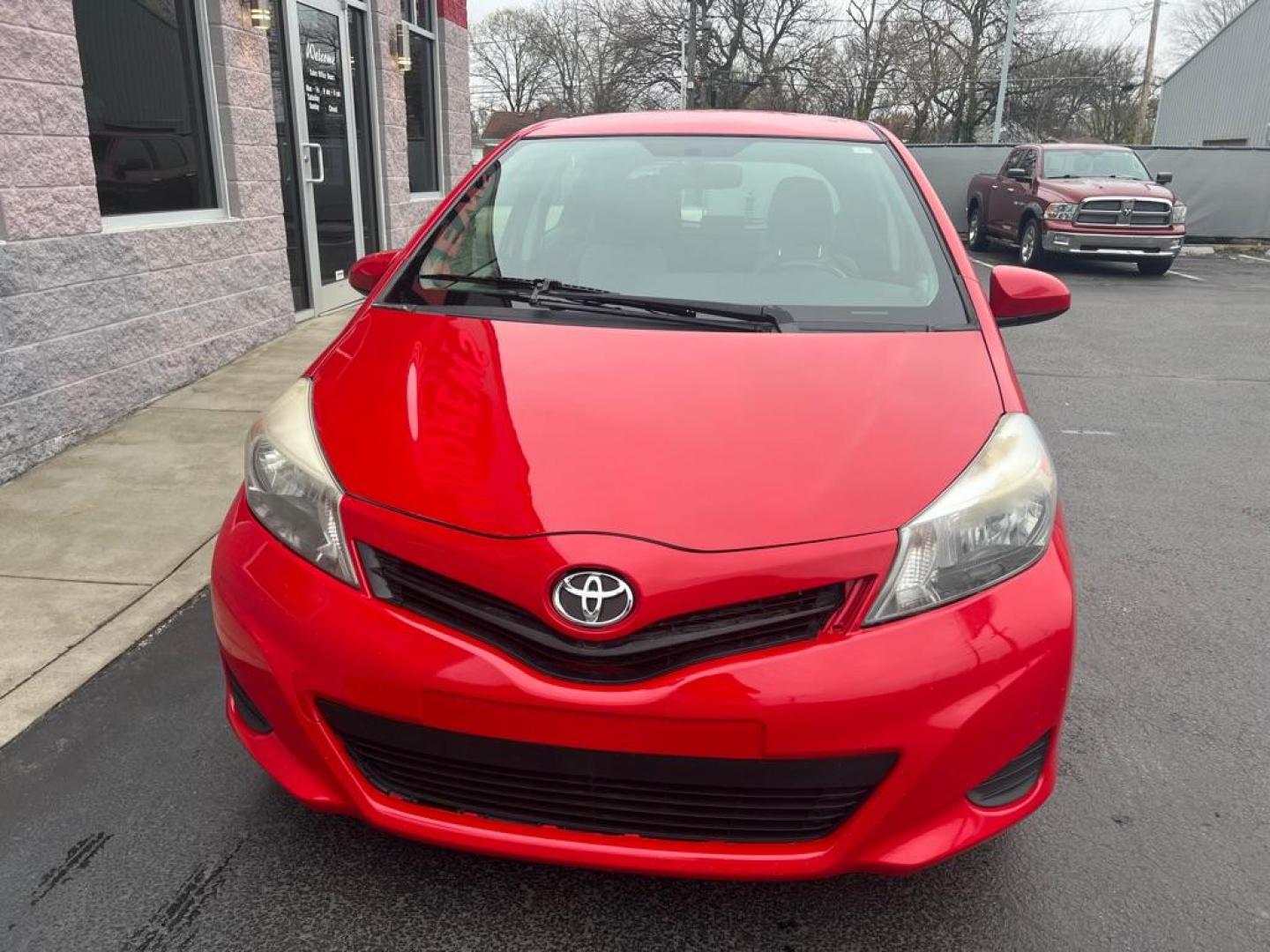2014 RED TOYOTA YARIS (JTDKTUD30ED) with an 1.5L engine, Automatic transmission, located at 3100 Covert Avenue, Evansville, IN, 47714, (812) 473-4492, 37.955418, -87.512238 - Photo#1
