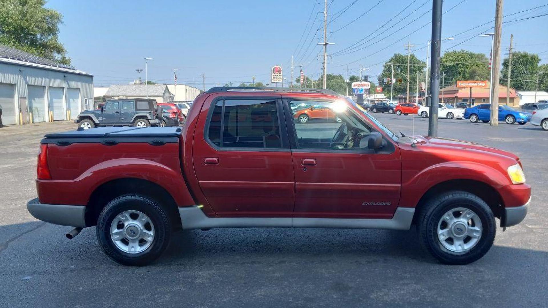 2002 RED FORD EXPLORER SPORT (1FMZU77E62U) with an 4.0L engine, Automatic transmission, located at 3100 Covert Avenue, Evansville, IN, 47714, (812) 473-4492, 37.955418, -87.512238 - Photo#2