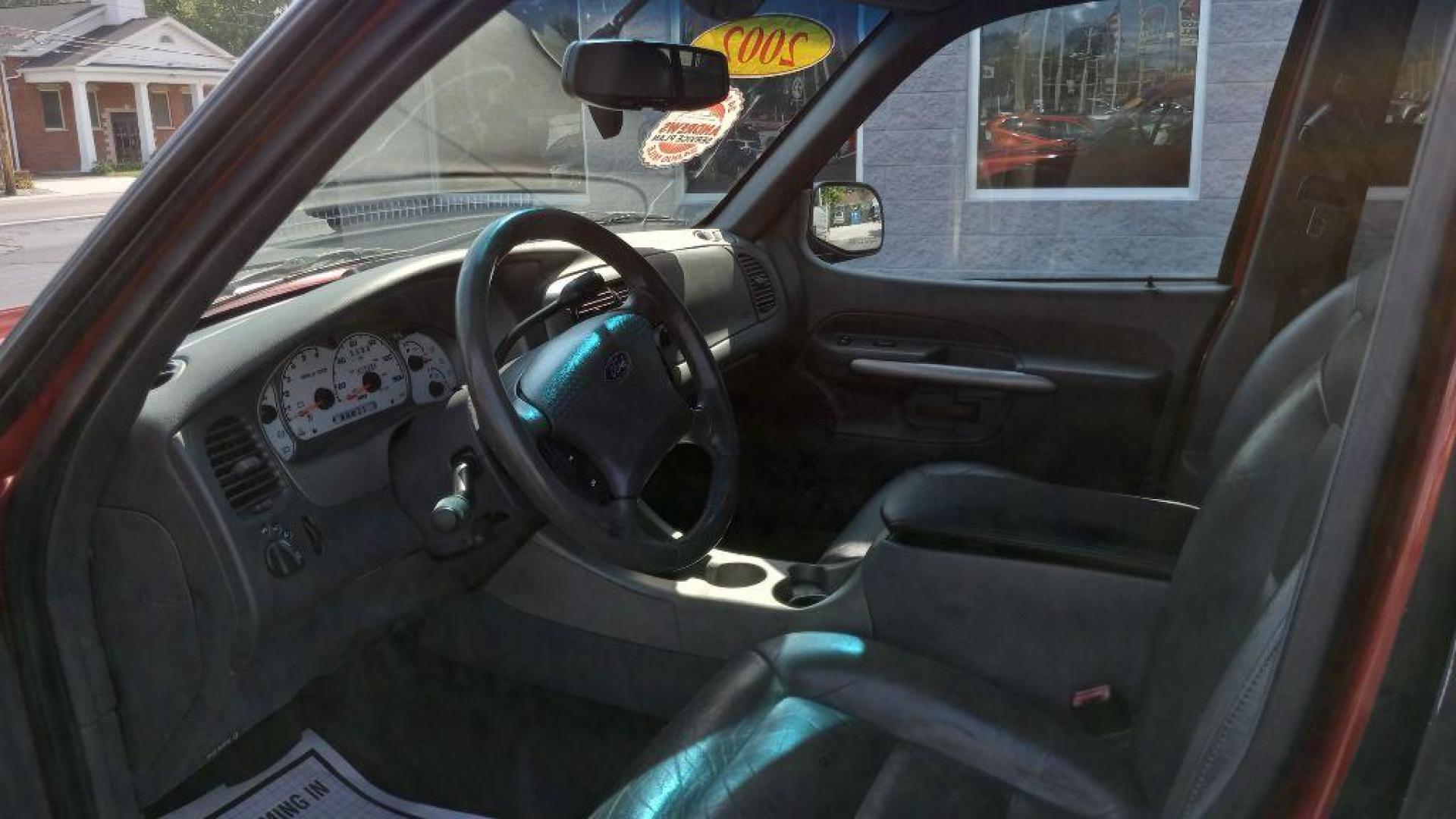 2002 RED FORD EXPLORER SPORT (1FMZU77E62U) with an 4.0L engine, Automatic transmission, located at 3100 Covert Avenue, Evansville, IN, 47714, (812) 473-4492, 37.955418, -87.512238 - Photo#4