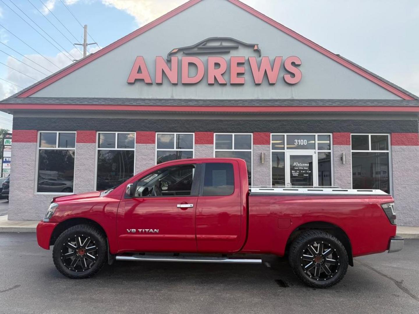 2006 RED NISSAN TITAN XE (1N6BA06A06N) with an 5.6L engine, Automatic transmission, located at 3100 Covert Avenue, Evansville, IN, 47714, (812) 473-4492, 37.955418, -87.512238 - Photo#0