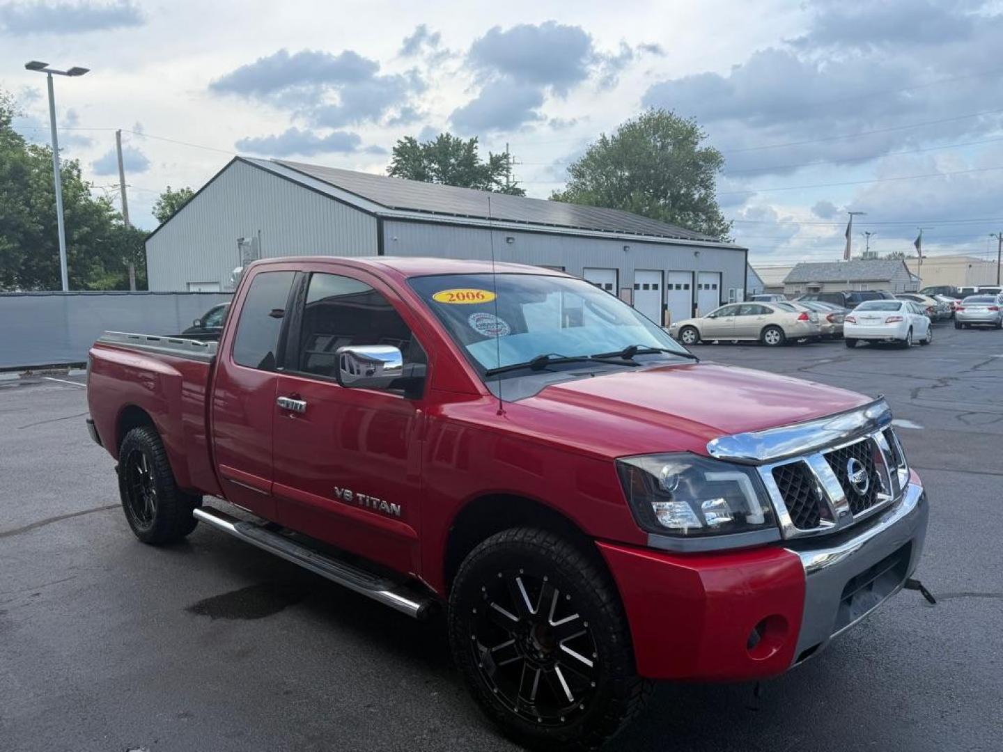 2006 RED NISSAN TITAN XE (1N6BA06A06N) with an 5.6L engine, Automatic transmission, located at 3100 Covert Avenue, Evansville, IN, 47714, (812) 473-4492, 37.955418, -87.512238 - Photo#2
