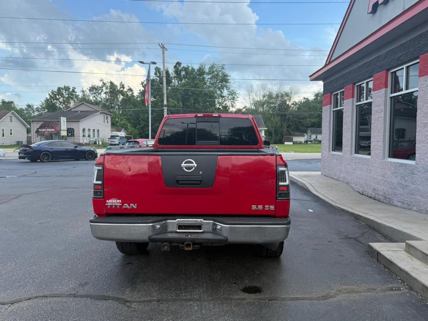 2006 RED NISSAN TITAN XE (1N6BA06A06N) with an 5.6L engine, Automatic transmission, located at 3100 Covert Avenue, Evansville, IN, 47714, (812) 473-4492, 37.955418, -87.512238 - Photo#3