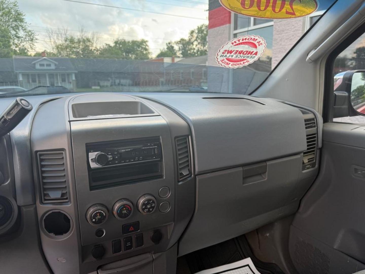 2006 RED NISSAN TITAN XE (1N6BA06A06N) with an 5.6L engine, Automatic transmission, located at 3100 Covert Avenue, Evansville, IN, 47714, (812) 473-4492, 37.955418, -87.512238 - Photo#5