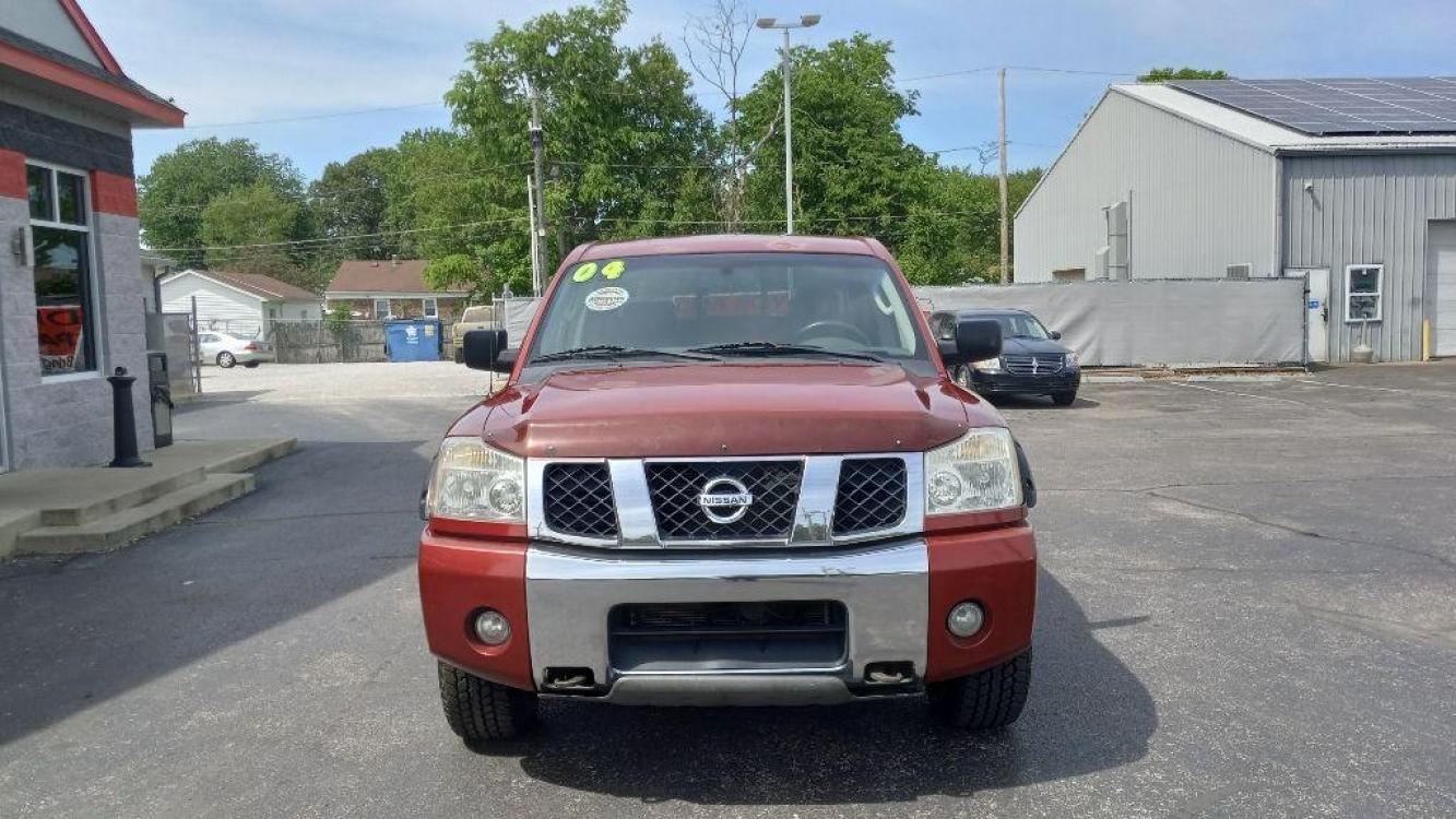 2004 RED NISSAN TITAN XE (1N6AA07BX4N) with an 5.6L engine, Automatic transmission, located at 3100 Covert Avenue, Evansville, IN, 47714, (812) 473-4492, 37.955418, -87.512238 - Photo #1