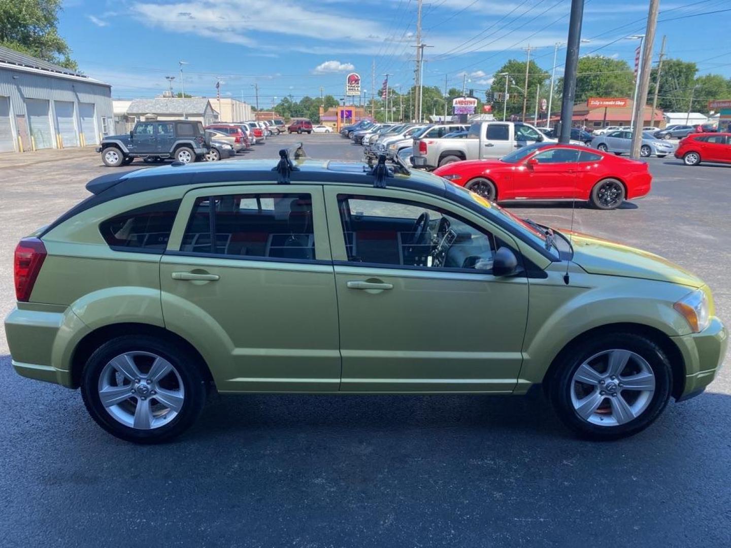 2010 GREEN DODGE CALIBER SXT (1B3CB4HA5AD) with an 2.0L engine, Automatic transmission, located at 3100 Covert Avenue, Evansville, IN, 47714, (812) 473-4492, 37.955418, -87.512238 - Photo#2