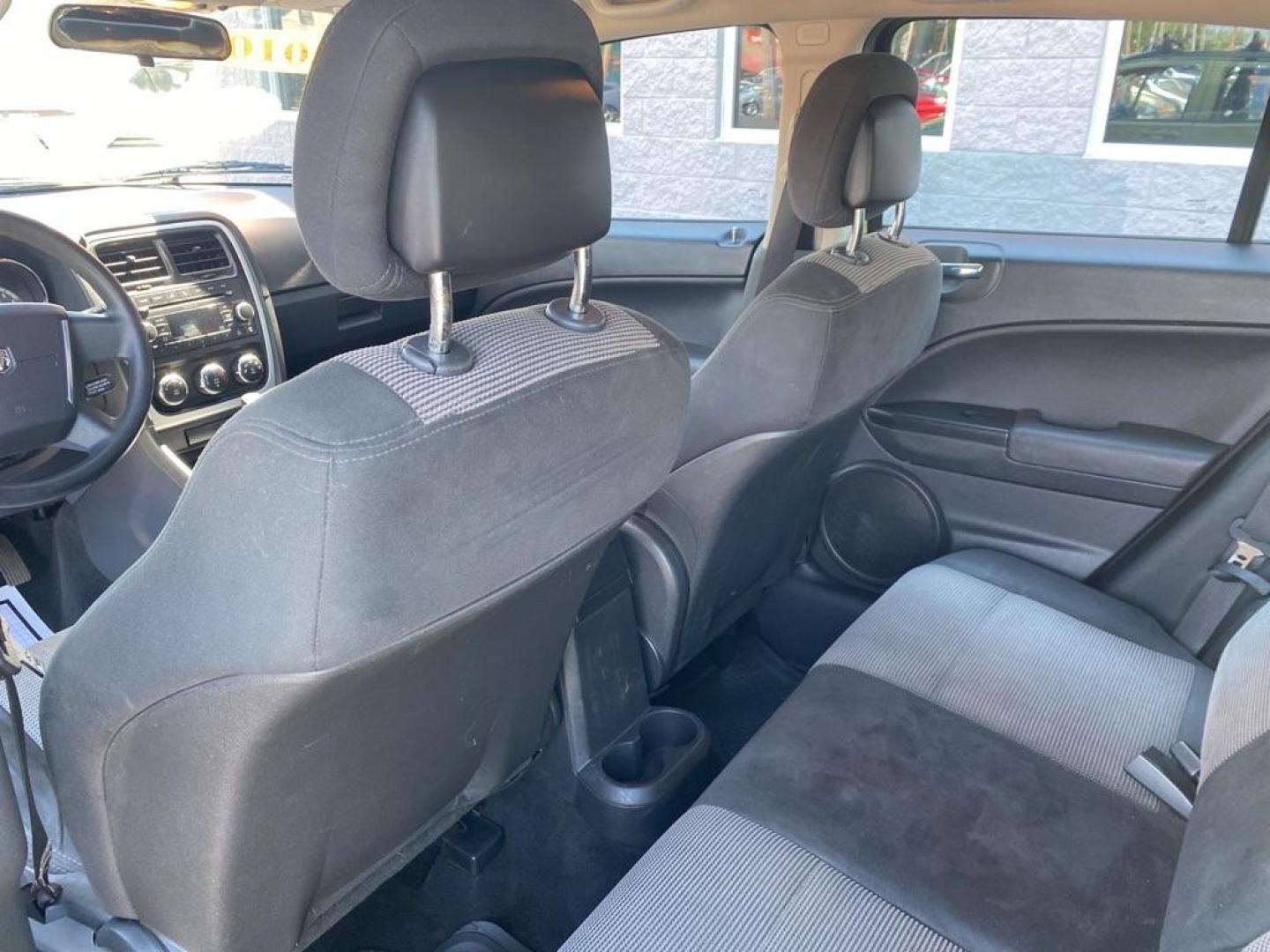 2010 GREEN DODGE CALIBER SXT (1B3CB4HA5AD) with an 2.0L engine, Automatic transmission, located at 3100 Covert Avenue, Evansville, IN, 47714, (812) 473-4492, 37.955418, -87.512238 - Photo#5