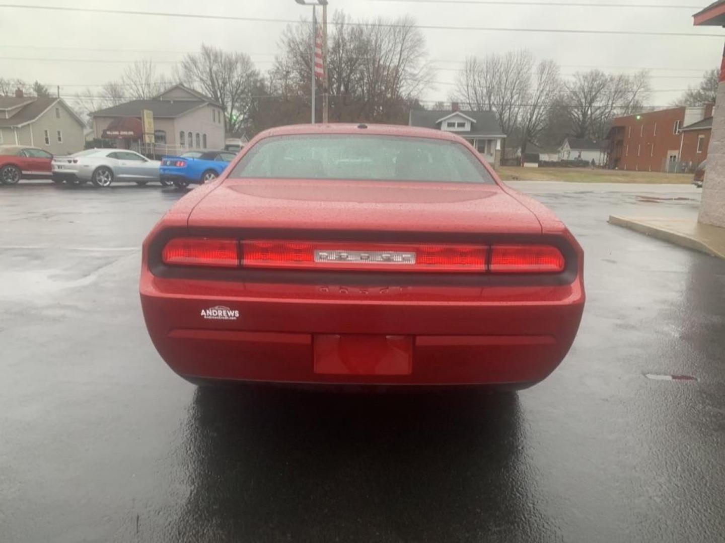 2009 RED DODGE CHALLENGER SE (2B3LJ44V89H) with an 3.5L engine, Automatic transmission, located at 3100 Covert Avenue, Evansville, IN, 47714, (812) 473-4492, 37.955418, -87.512238 - Photo#6