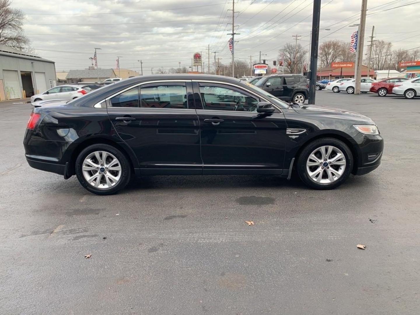 2012 BLACK FORD TAURUS SEL (1FAHP2EW4CG) with an 3.5L engine, Automatic transmission, located at 3100 Covert Avenue, Evansville, IN, 47714, (812) 473-4492, 37.955418, -87.512238 - Photo#5