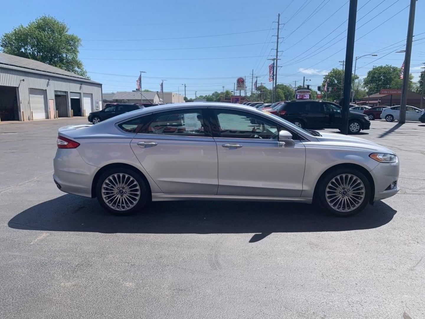 2014 SILVER FORD FUSION TITANIUM (3FA6P0K94ER) with an 2.0L engine, Automatic transmission, located at 3100 Covert Avenue, Evansville, IN, 47714, (812) 473-4492, 37.955418, -87.512238 - Photo#2