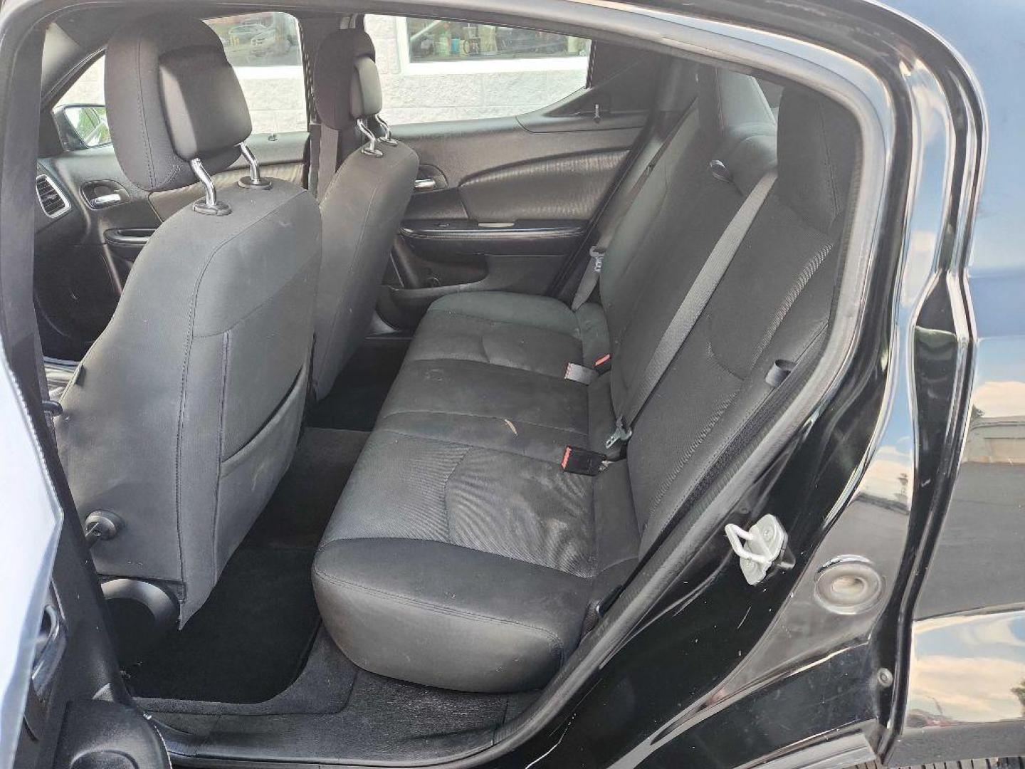 2014 BLACK DODGE AVENGER SXT (1C3CDZCB2EN) with an 2.4L engine, Automatic transmission, located at 3100 Covert Avenue, Evansville, IN, 47714, (812) 473-4492, 37.955418, -87.512238 - Photo#5