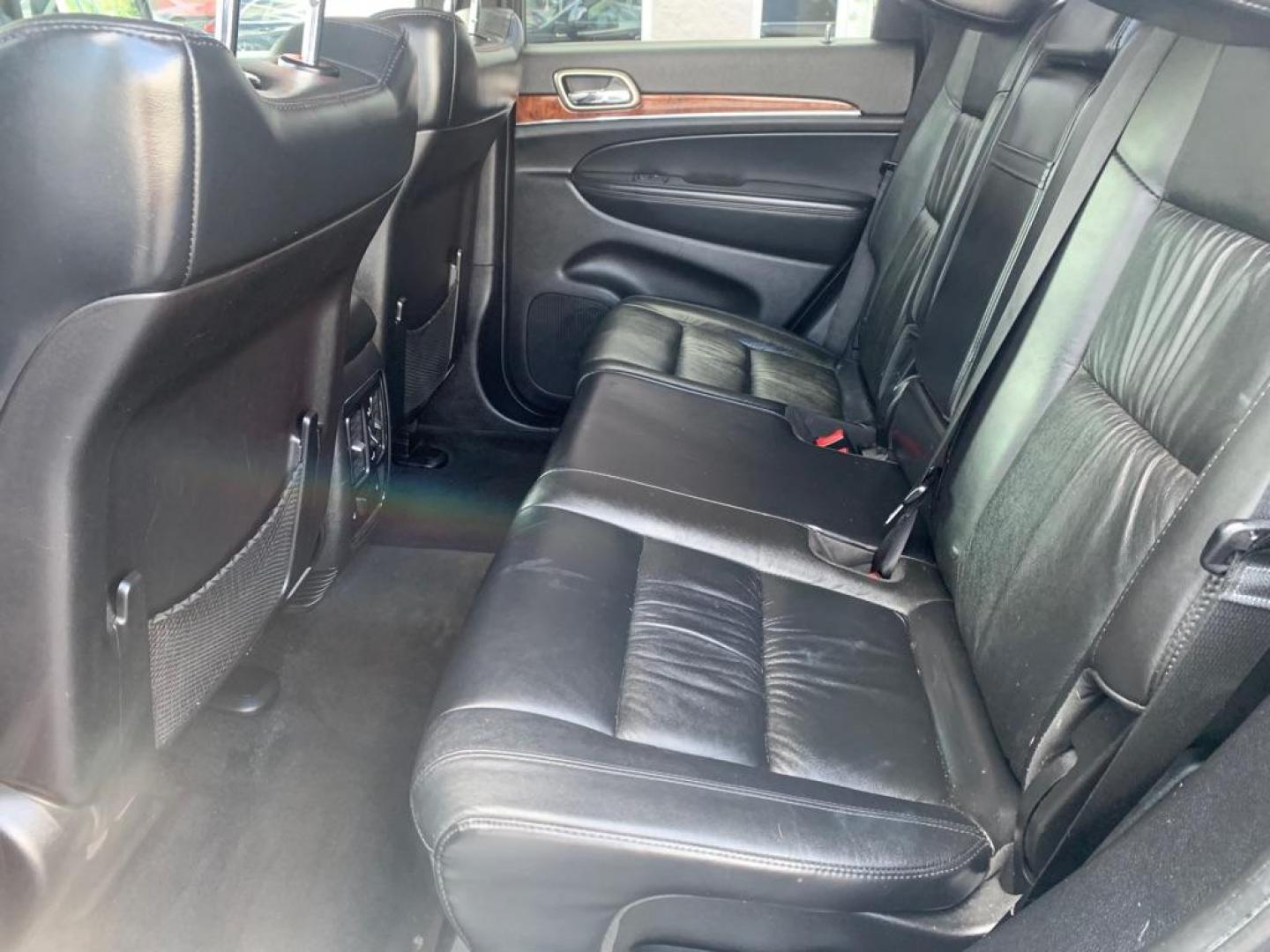 2012 BLACK JEEP GRAND CHEROKEE LIMITED (1C4RJFBGXCC) with an 3.6L engine, Automatic transmission, located at 3100 Covert Avenue, Evansville, IN, 47714, (812) 473-4492, 37.955418, -87.512238 - Photo#5