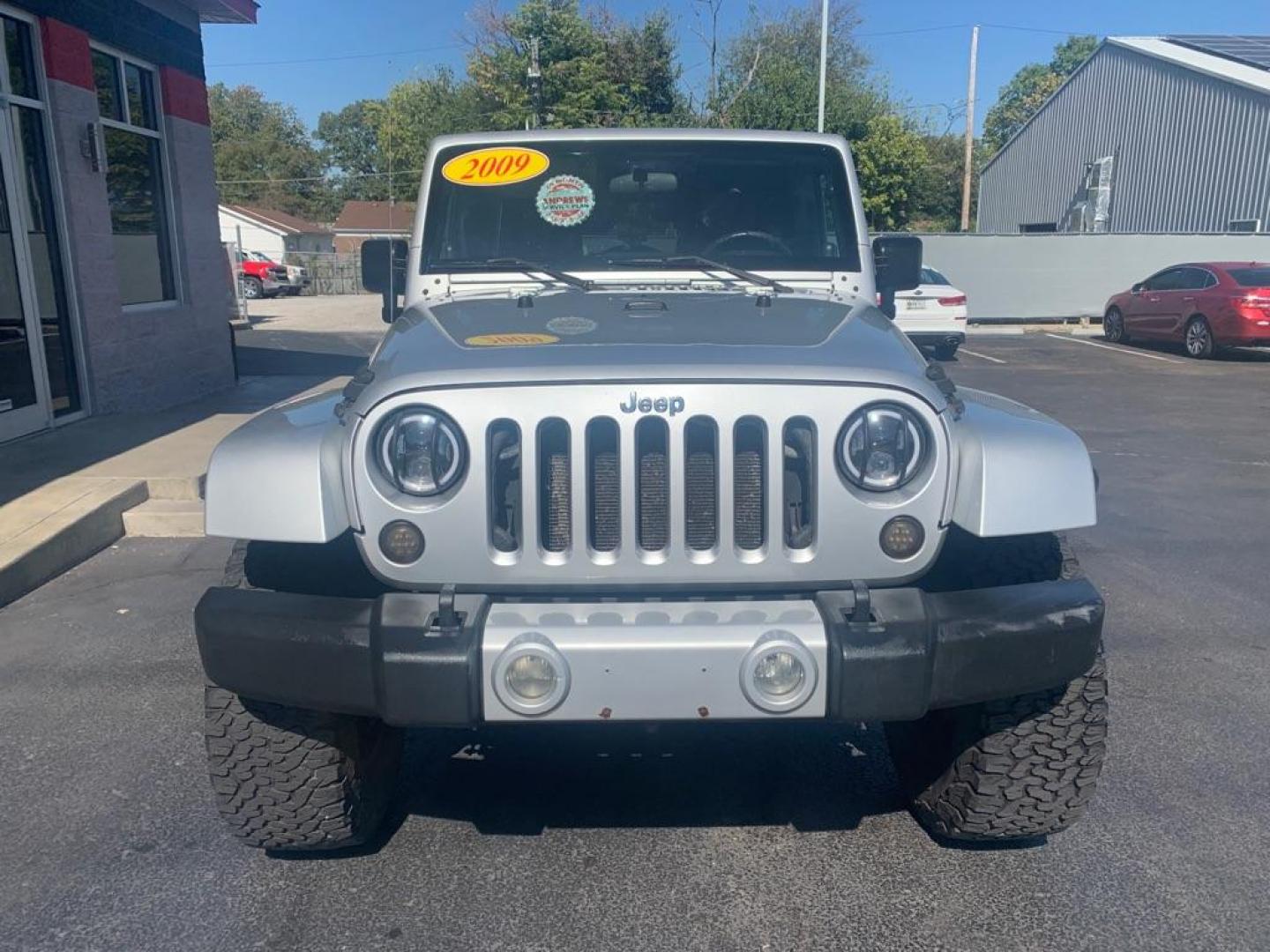 2009 SILVER JEEP WRANGLER UNLIMI SAHARA (1J8GA59159L) with an 3.8L engine, Automatic transmission, located at 3100 Covert Avenue, Evansville, IN, 47714, (812) 473-4492, 37.955418, -87.512238 - Photo#2