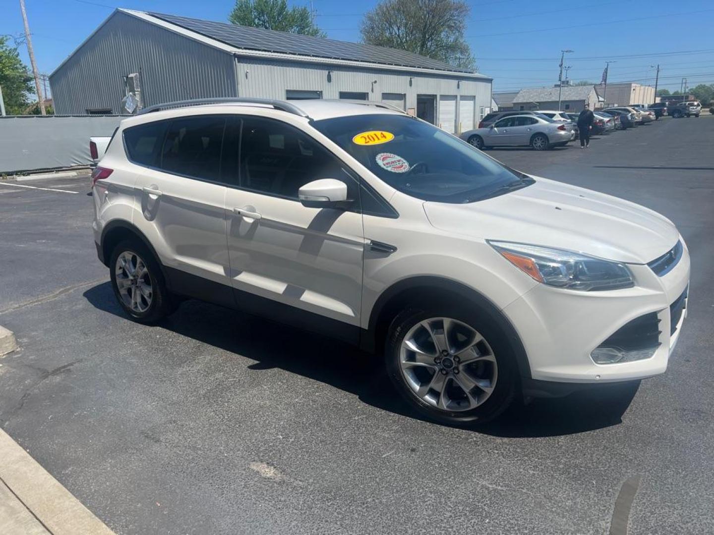 2014 WHITE FORD ESCAPE TITANIUM (1FMCU0JX3EU) with an 1.6L engine, Automatic transmission, located at 3100 Covert Avenue, Evansville, IN, 47714, (812) 473-4492, 37.955418, -87.512238 - Photo#2