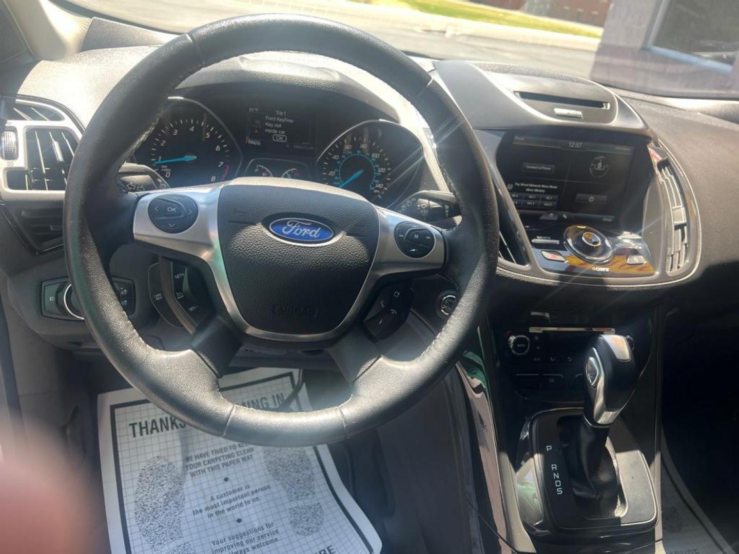 2014 WHITE FORD ESCAPE TITANIUM (1FMCU0JX3EU) with an 1.6L engine, Automatic transmission, located at 3100 Covert Avenue, Evansville, IN, 47714, (812) 473-4492, 37.955418, -87.512238 - Photo#4