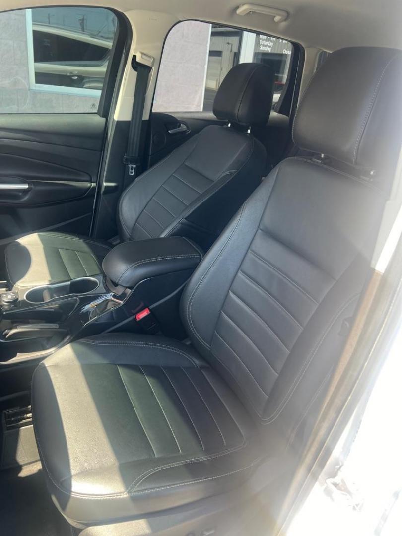 2014 WHITE FORD ESCAPE TITANIUM (1FMCU0JX3EU) with an 1.6L engine, Automatic transmission, located at 3100 Covert Avenue, Evansville, IN, 47714, (812) 473-4492, 37.955418, -87.512238 - Photo#5