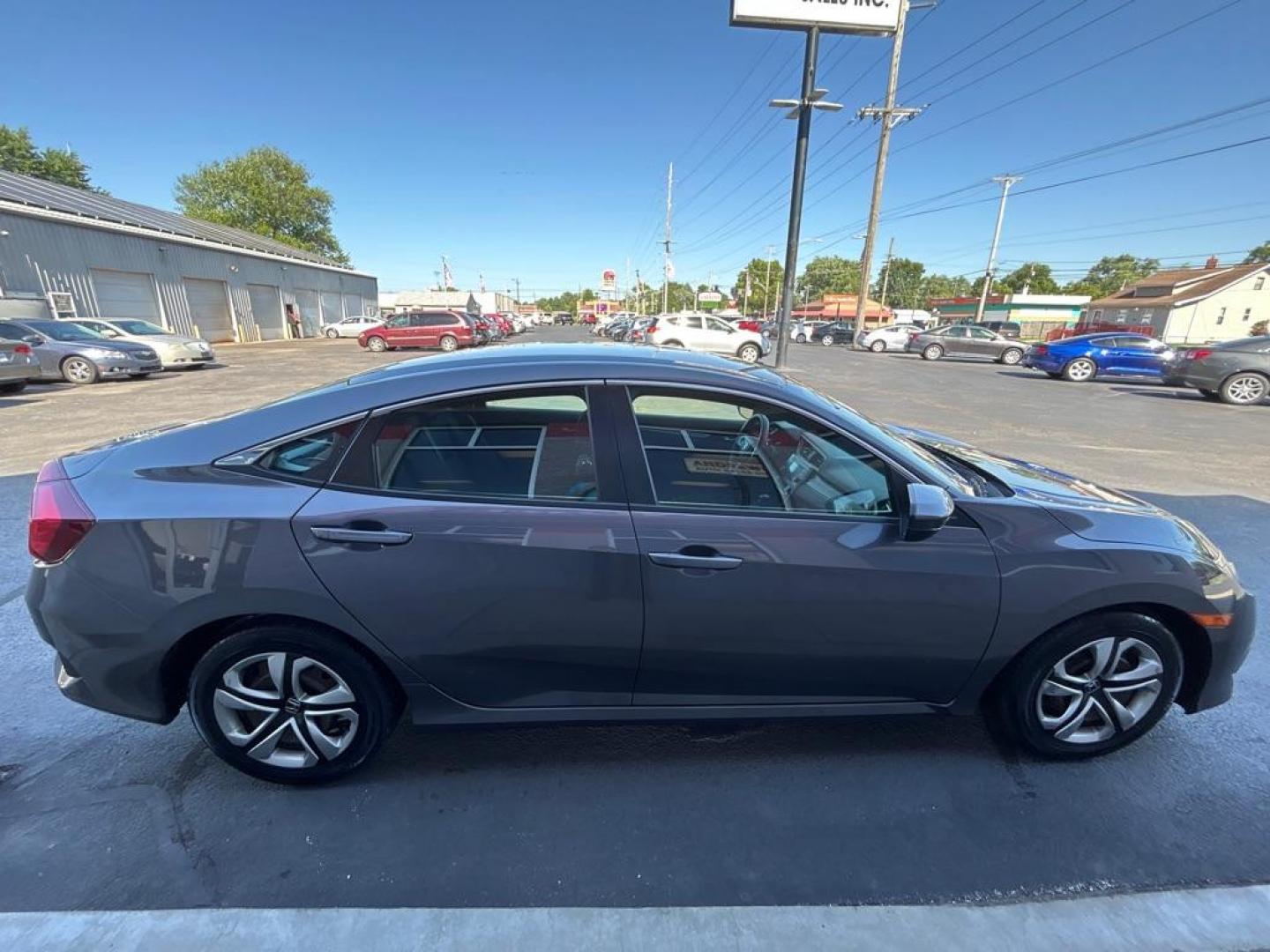 2017 GRAY HONDA CIVIC LX (2HGFC2F54HH) with an 2.0L engine, Continuously Variable transmission, located at 3100 Covert Avenue, Evansville, IN, 47714, (812) 473-4492, 37.955418, -87.512238 - Photo#2
