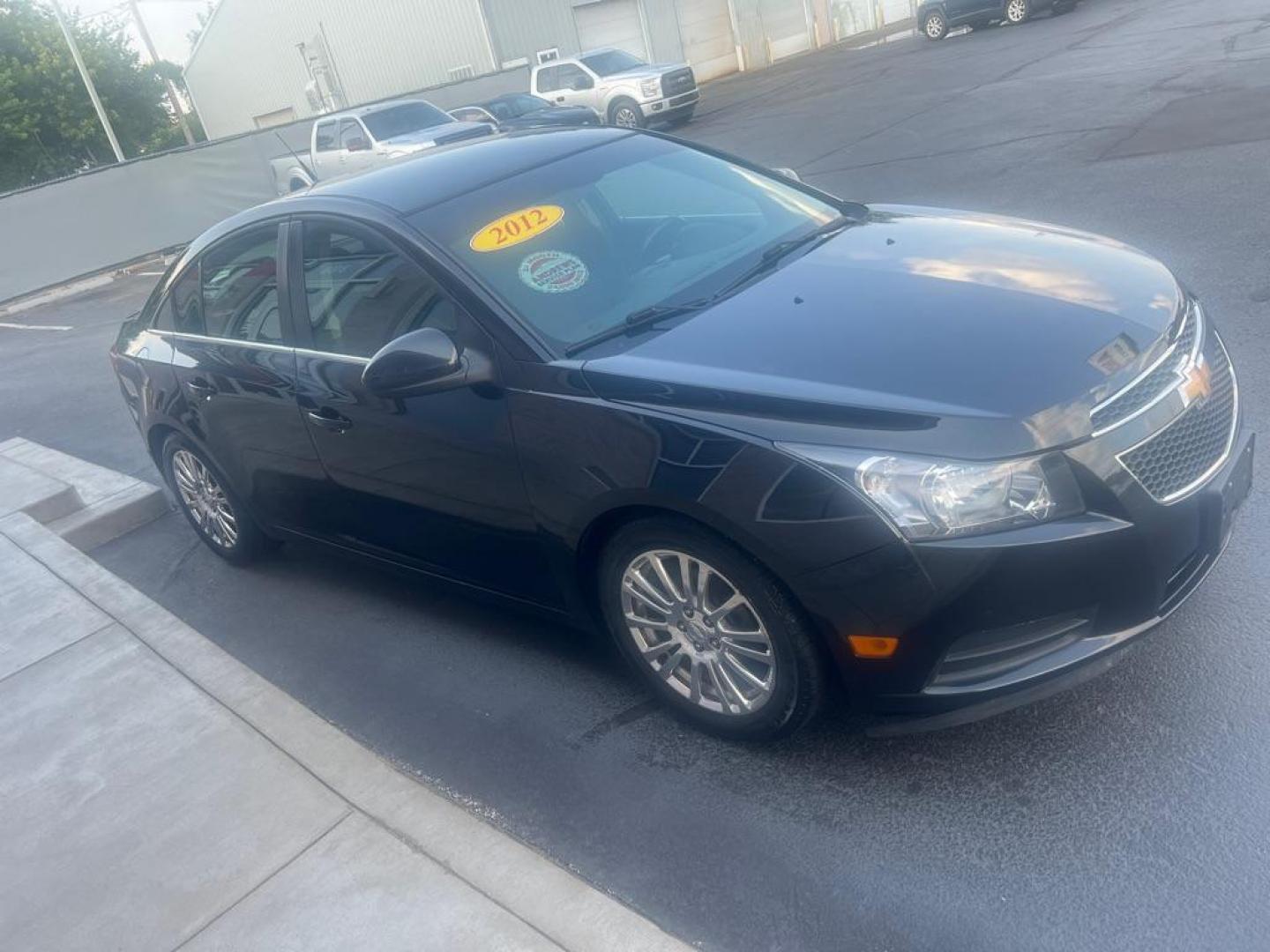 2012 BLACK CHEVROLET CRUZE ECO (1G1PJ5SC6C7) with an 1.4L engine, Automatic transmission, located at 3100 Covert Avenue, Evansville, IN, 47714, (812) 473-4492, 37.955418, -87.512238 - Photo#2