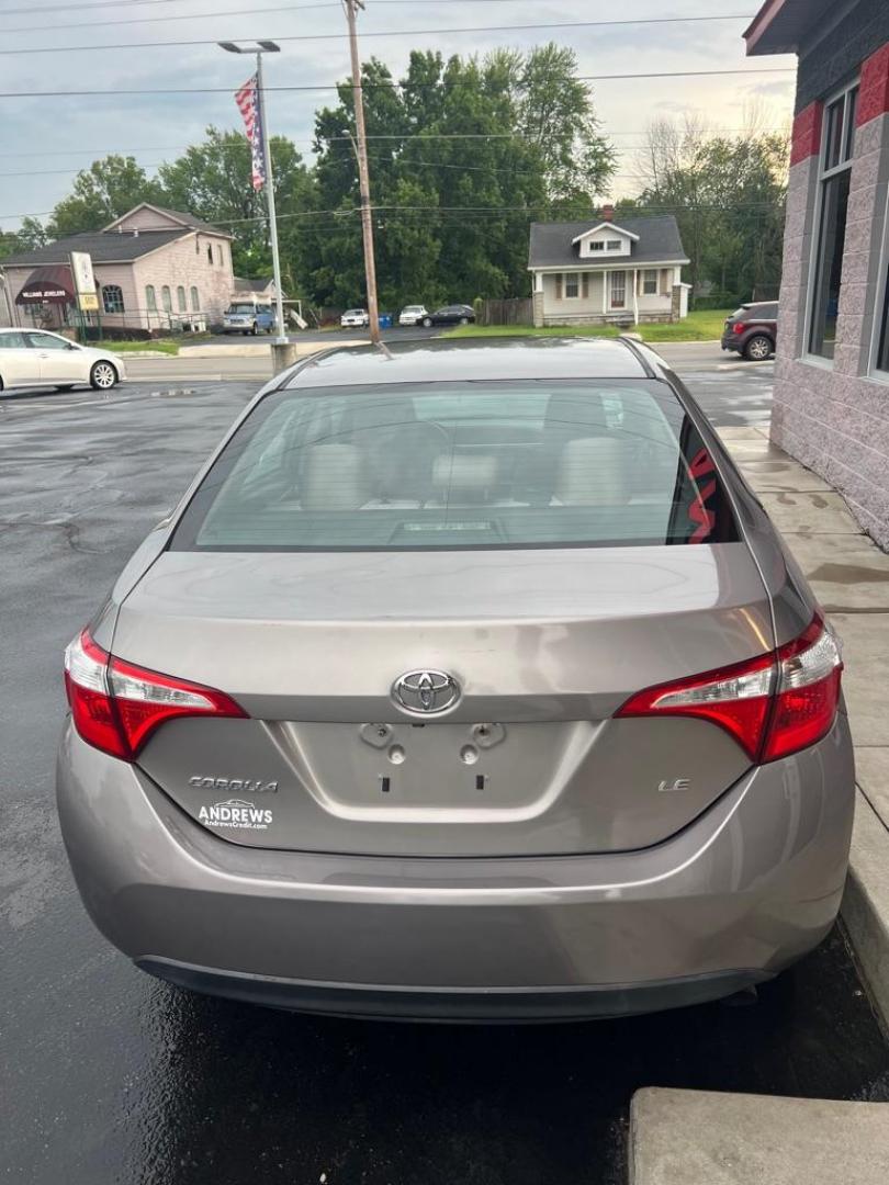 2014 GOLD TOYOTA COROLLA L (5YFBURHE7EP) with an 1.8L engine, Automatic transmission, located at 3100 Covert Avenue, Evansville, IN, 47714, (812) 473-4492, 37.955418, -87.512238 - Photo#3