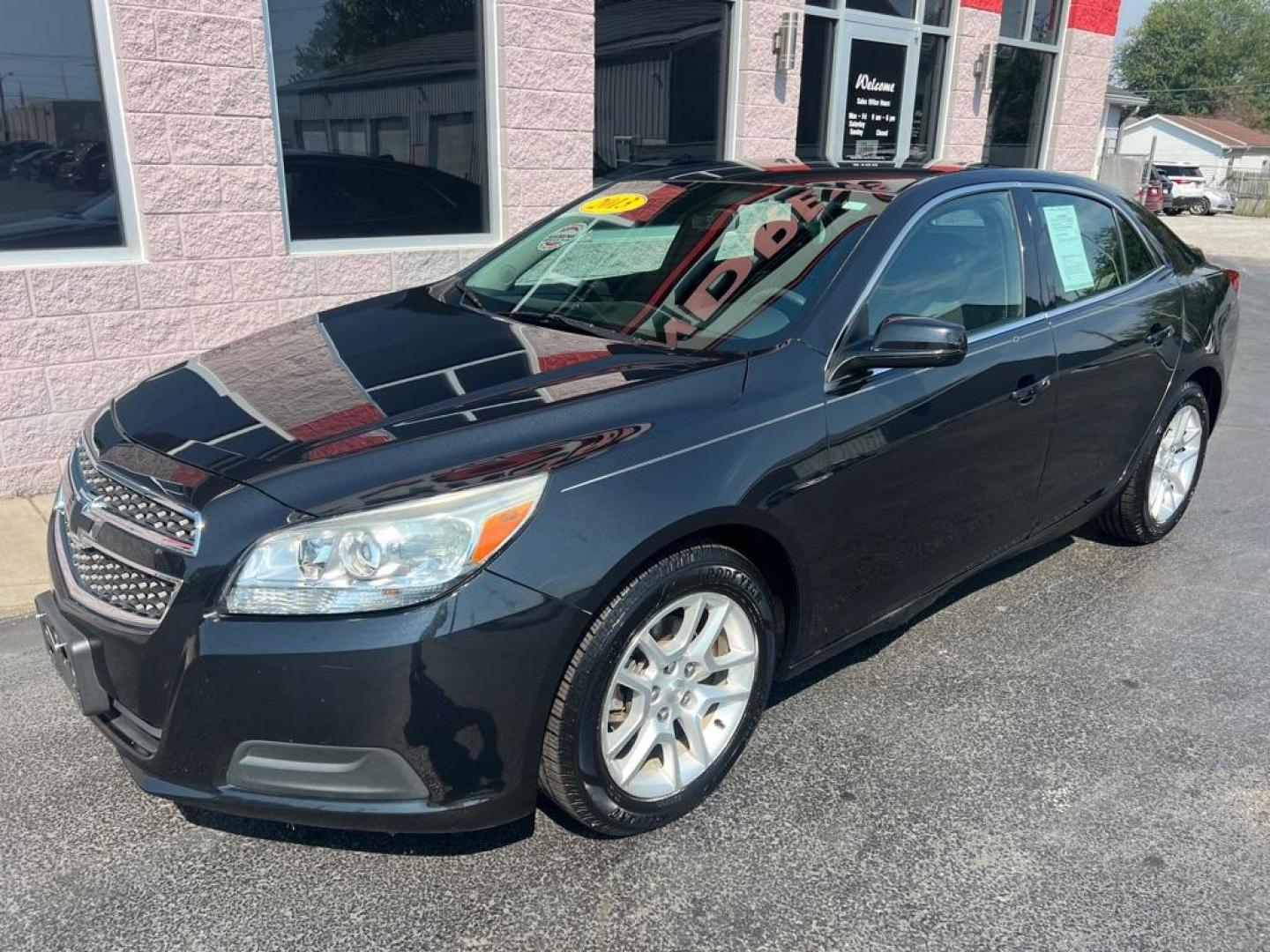 2013 BLACK CHEVROLET MALIBU 1LT (1G11D5RR6DF) with an 2.4L engine, Automatic transmission, located at 3100 Covert Avenue, Evansville, IN, 47714, (812) 473-4492, 37.955418, -87.512238 - Photo#2