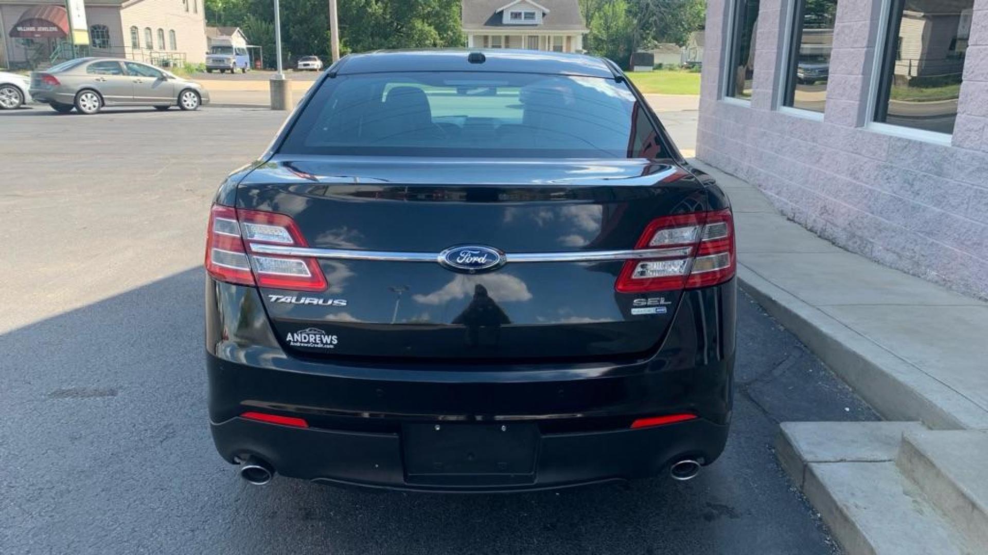 2015 BLACK FORD TAURUS SEL (1FAHP2H81FG) with an 3.5L engine, Automatic transmission, located at 3100 Covert Avenue, Evansville, IN, 47714, (812) 473-4492, 37.955418, -87.512238 - Photo#9