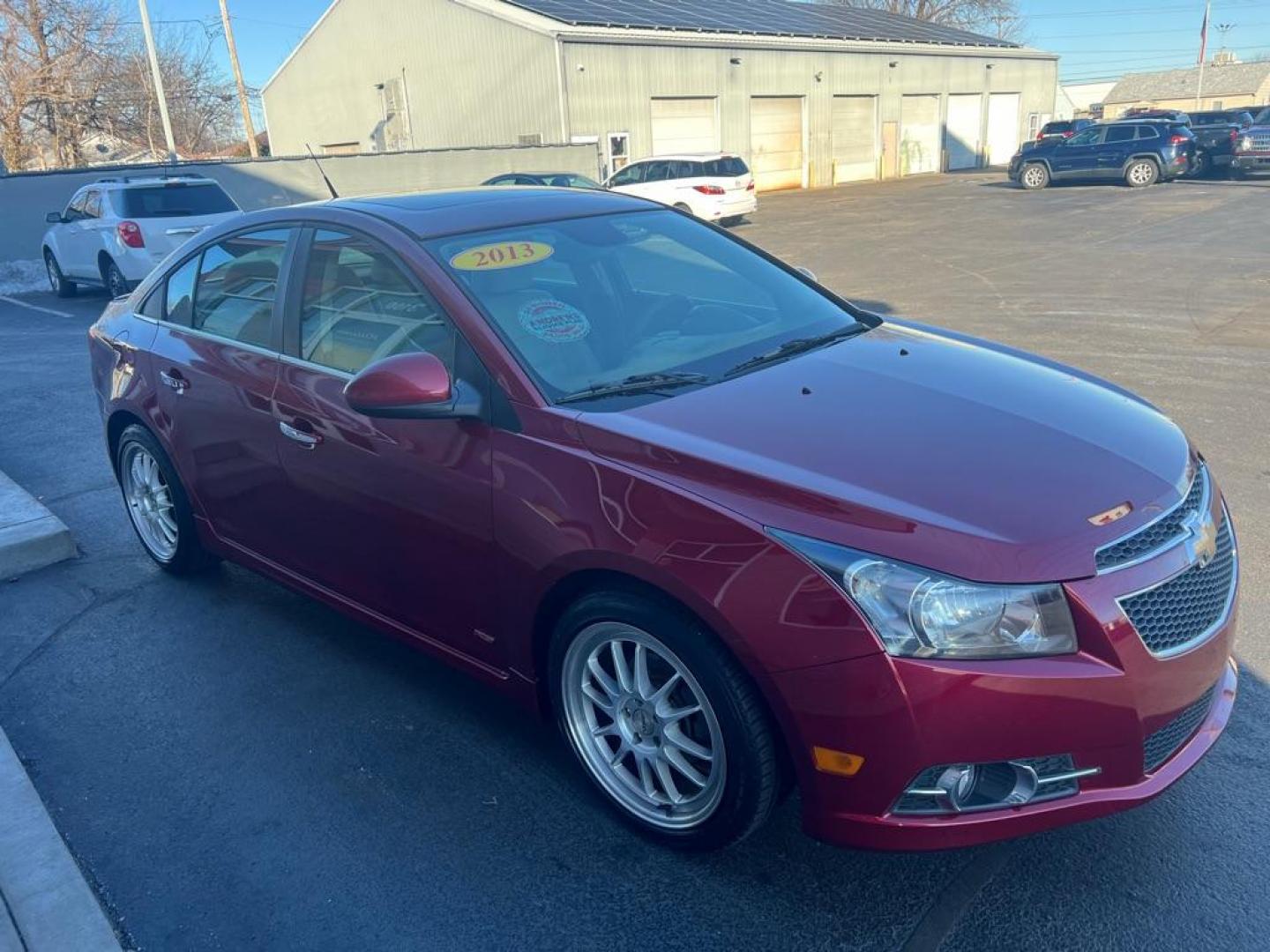 2013 RED CHEVROLET CRUZE LTZ (1G1PG5SB6D7) with an 1.4L engine, Automatic transmission, located at 3100 Covert Avenue, Evansville, IN, 47714, (812) 473-4492, 37.955418, -87.512238 - Photo#2