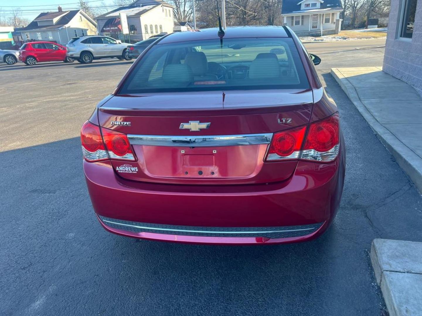 2013 RED CHEVROLET CRUZE LTZ (1G1PG5SB6D7) with an 1.4L engine, Automatic transmission, located at 3100 Covert Avenue, Evansville, IN, 47714, (812) 473-4492, 37.955418, -87.512238 - Photo#3