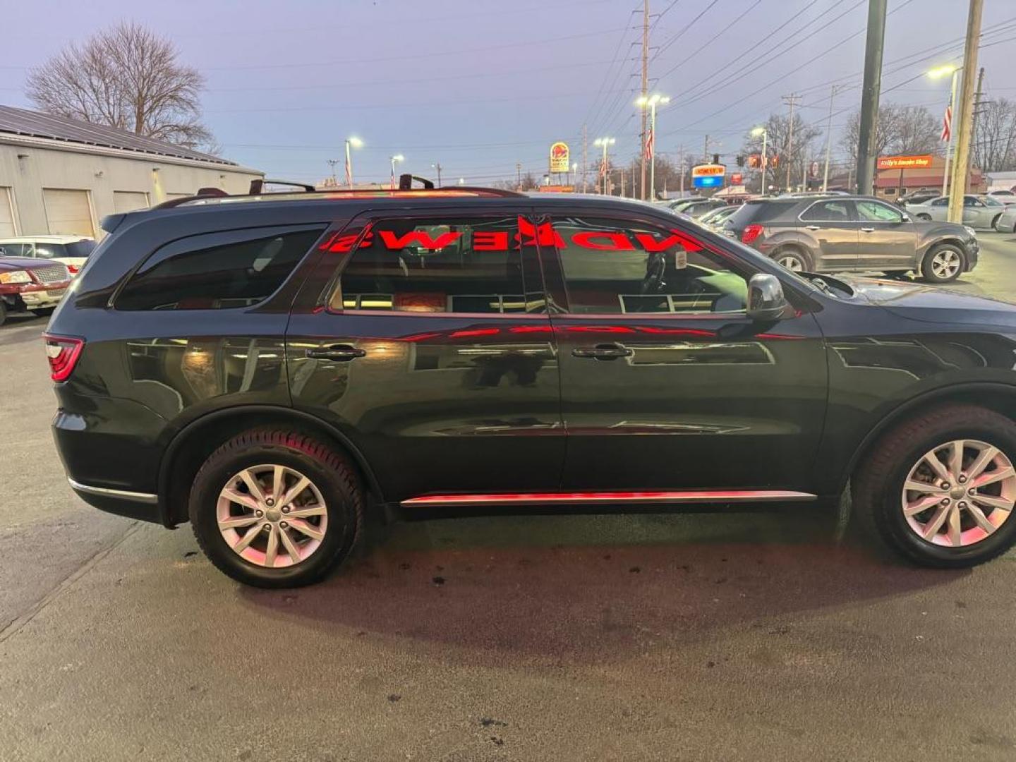 2015 BLACK DODGE DURANGO SXT (1C4RDJAG4FC) with an 3.6L engine, Automatic transmission, located at 3100 Covert Avenue, Evansville, IN, 47714, (812) 473-4492, 37.955418, -87.512238 - Photo#2