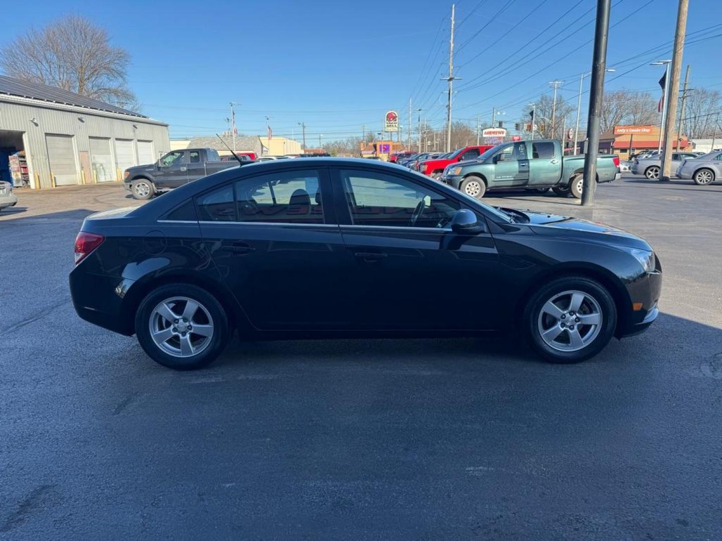 2014 BLACK CHEVROLET CRUZE LT (1G1PC5SBXE7) with an 1.4L engine, Automatic transmission, located at 3100 Covert Avenue, Evansville, IN, 47714, (812) 473-4492, 37.955418, -87.512238 - Photo#2