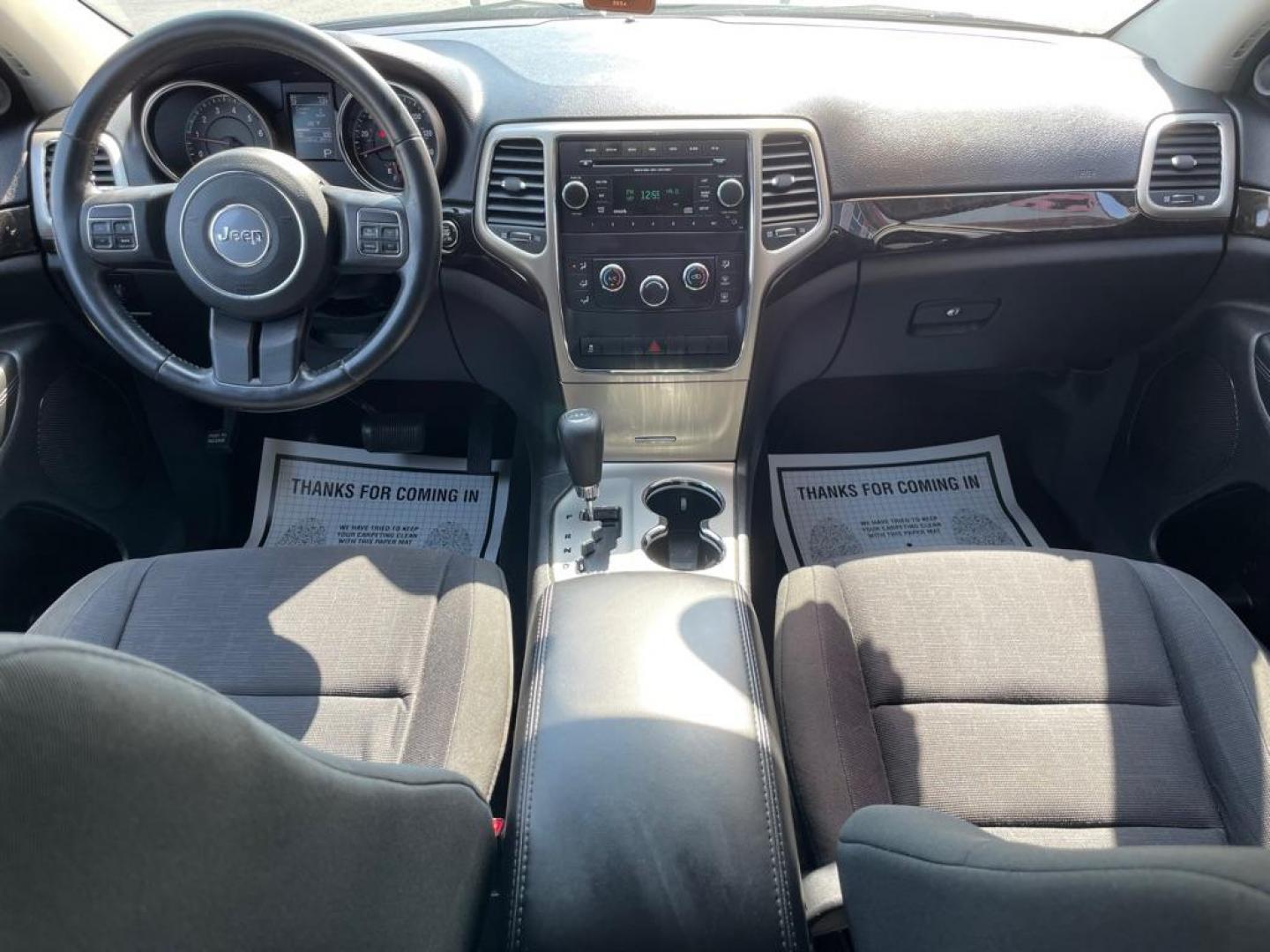 2012 BLACK JEEP GRAND CHEROKEE LAREDO (1C4RJFAG5CC) with an 3.6L engine, Automatic transmission, located at 3100 Covert Avenue, Evansville, IN, 47714, (812) 473-4492, 37.955418, -87.512238 - Photo#5