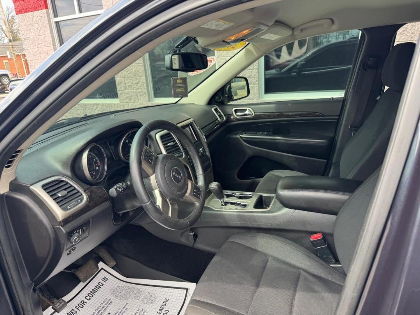 2013 BLACK JEEP GRAND CHEROKEE LAREDO (1C4RJFAG3DC) with an 3.6L engine, Automatic transmission, located at 3100 Covert Avenue, Evansville, IN, 47714, (812) 473-4492, 37.955418, -87.512238 - Photo#4