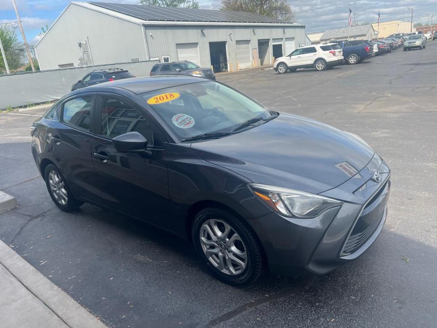 2018 GRAY TOYOTA YARIS IA (3MYDLBYV1JY) with an 1.5L engine, Automatic transmission, located at 3100 Covert Avenue, Evansville, IN, 47714, (812) 473-4492, 37.955418, -87.512238 - Photo#2