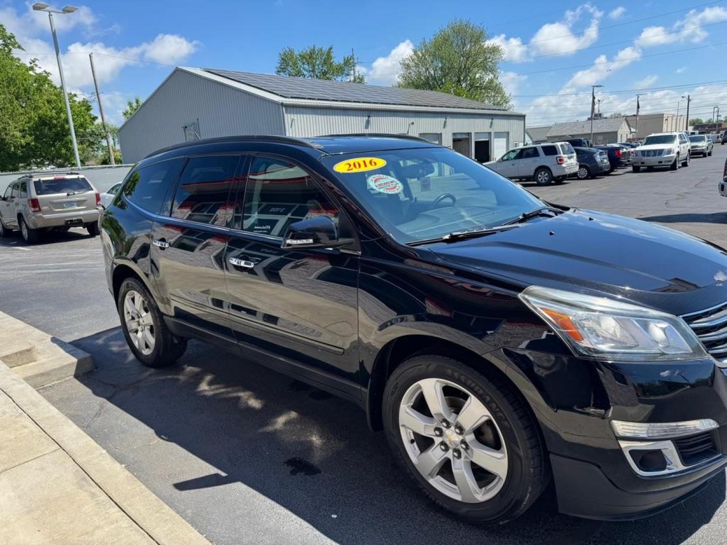 2016 BLACK CHEVROLET TRAVERSE LT (1GNKVGKD3GJ) with an 3.6L engine, Automatic transmission, located at 3100 Covert Avenue, Evansville, IN, 47714, (812) 473-4492, 37.955418, -87.512238 - Photo#2