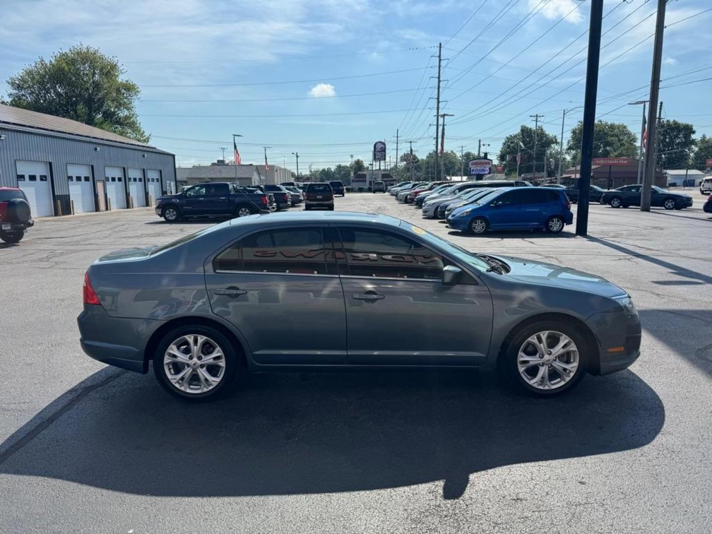2012 BLUE FORD FUSION SE (3FAHP0HA1CR) with an 2.5L engine, Automatic transmission, located at 3100 Covert Avenue, Evansville, IN, 47714, (812) 473-4492, 37.955418, -87.512238 - Photo#2