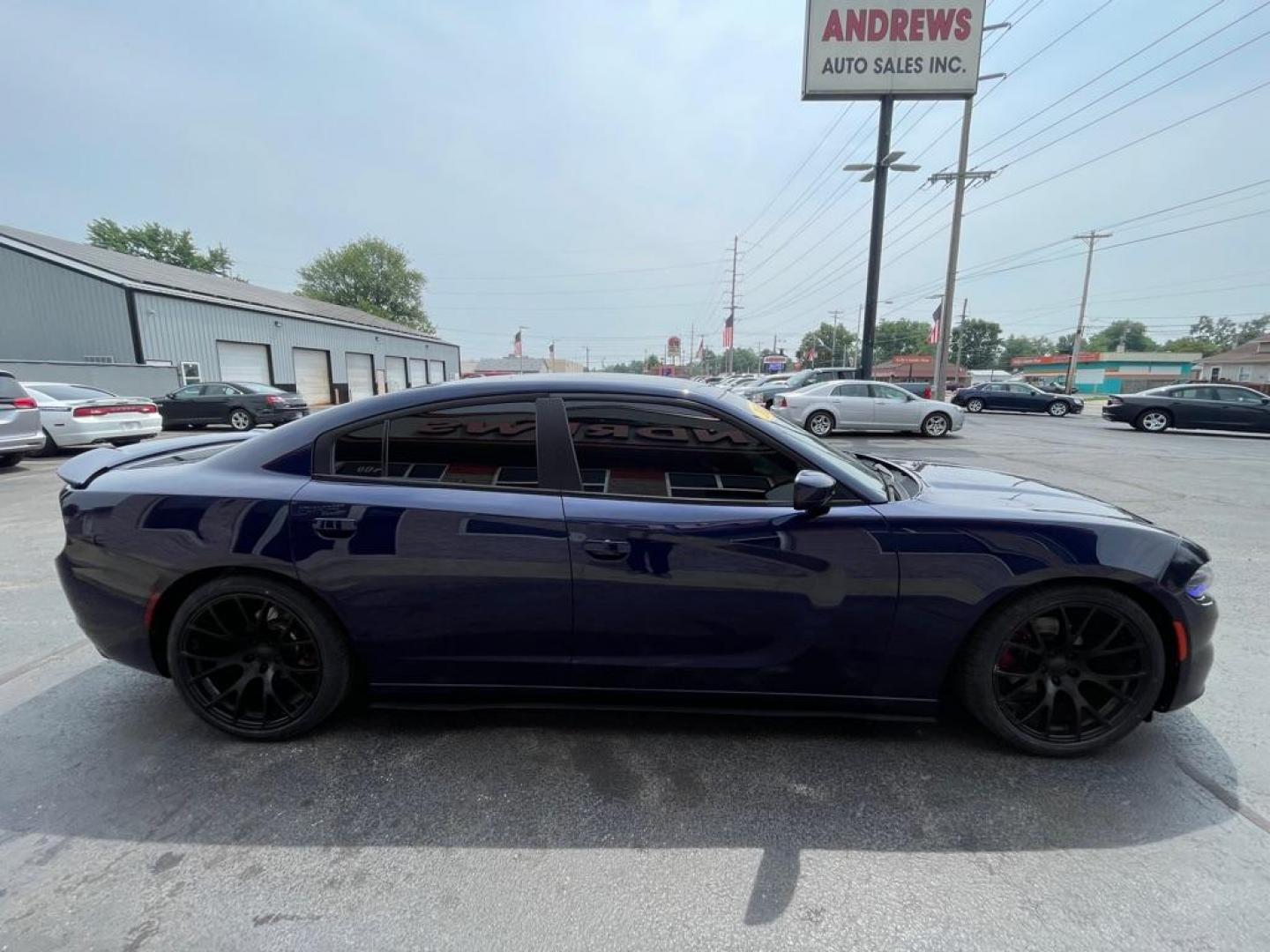 2015 BLUE DODGE CHARGER SE (2C3CDXBG4FH) with an 3.6L engine, Automatic transmission, located at 3100 Covert Avenue, Evansville, IN, 47714, (812) 473-4492, 37.955418, -87.512238 - Photo#2