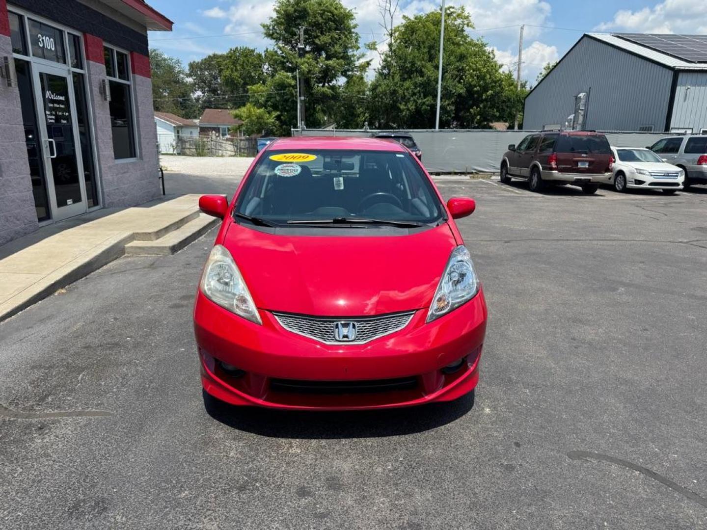 2009 RED HONDA FIT SPORT (JHMGE88449C) with an 1.5L engine, Automatic transmission, located at 3100 Covert Avenue, Evansville, IN, 47714, (812) 473-4492, 37.955418, -87.512238 - Photo#1