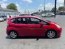 2009 RED HONDA FIT SPORT (JHMGE88449C) with an 1.5L engine, Automatic transmission, located at 3100 Covert Avenue, Evansville, IN, 47714, (812) 473-4492, 37.955418, -87.512238 - Photo#2