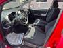 2009 RED HONDA FIT SPORT (JHMGE88449C) with an 1.5L engine, Automatic transmission, located at 3100 Covert Avenue, Evansville, IN, 47714, (812) 473-4492, 37.955418, -87.512238 - Photo#4