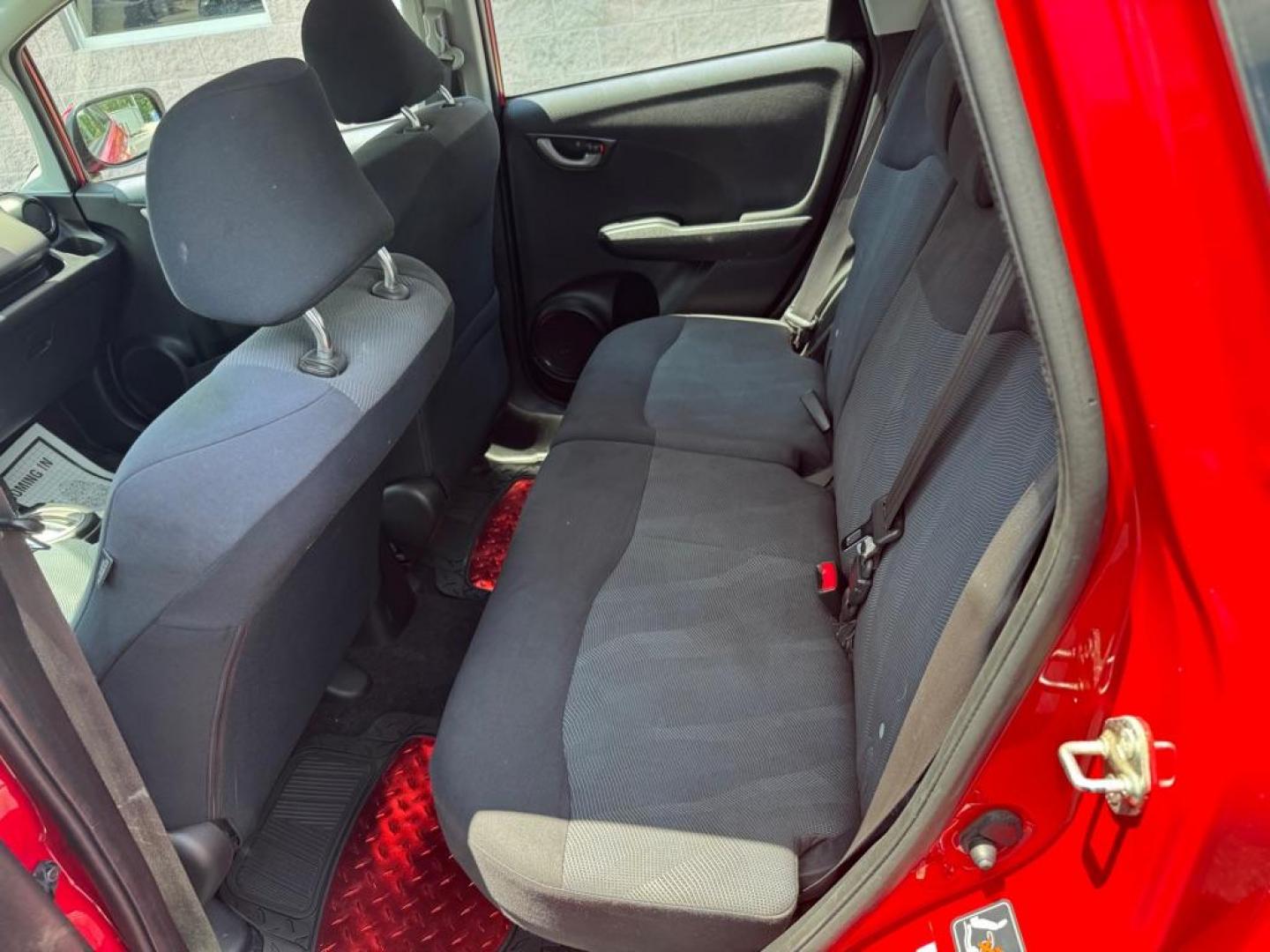 2009 RED HONDA FIT SPORT (JHMGE88449C) with an 1.5L engine, Automatic transmission, located at 3100 Covert Avenue, Evansville, IN, 47714, (812) 473-4492, 37.955418, -87.512238 - Photo#5