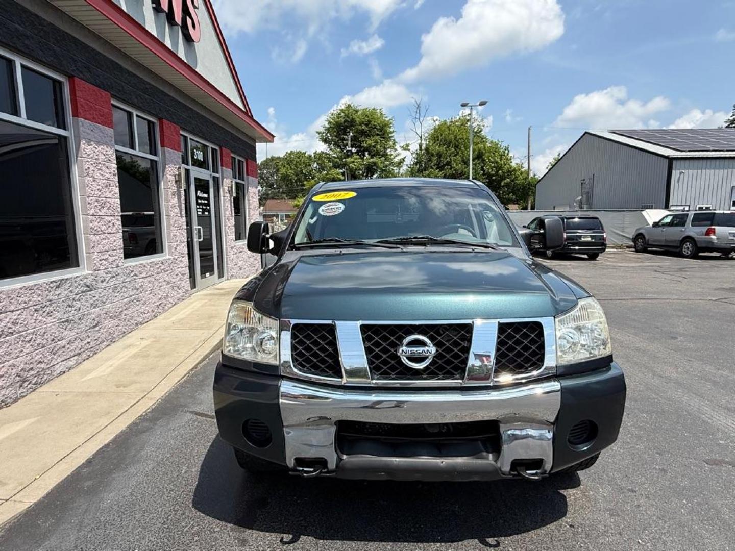 2007 GREEN NISSAN TITAN XE (1N6AA07B47N) with an 5.6L engine, Automatic transmission, located at 3100 Covert Avenue, Evansville, IN, 47714, (812) 473-4492, 37.955418, -87.512238 - Photo#1