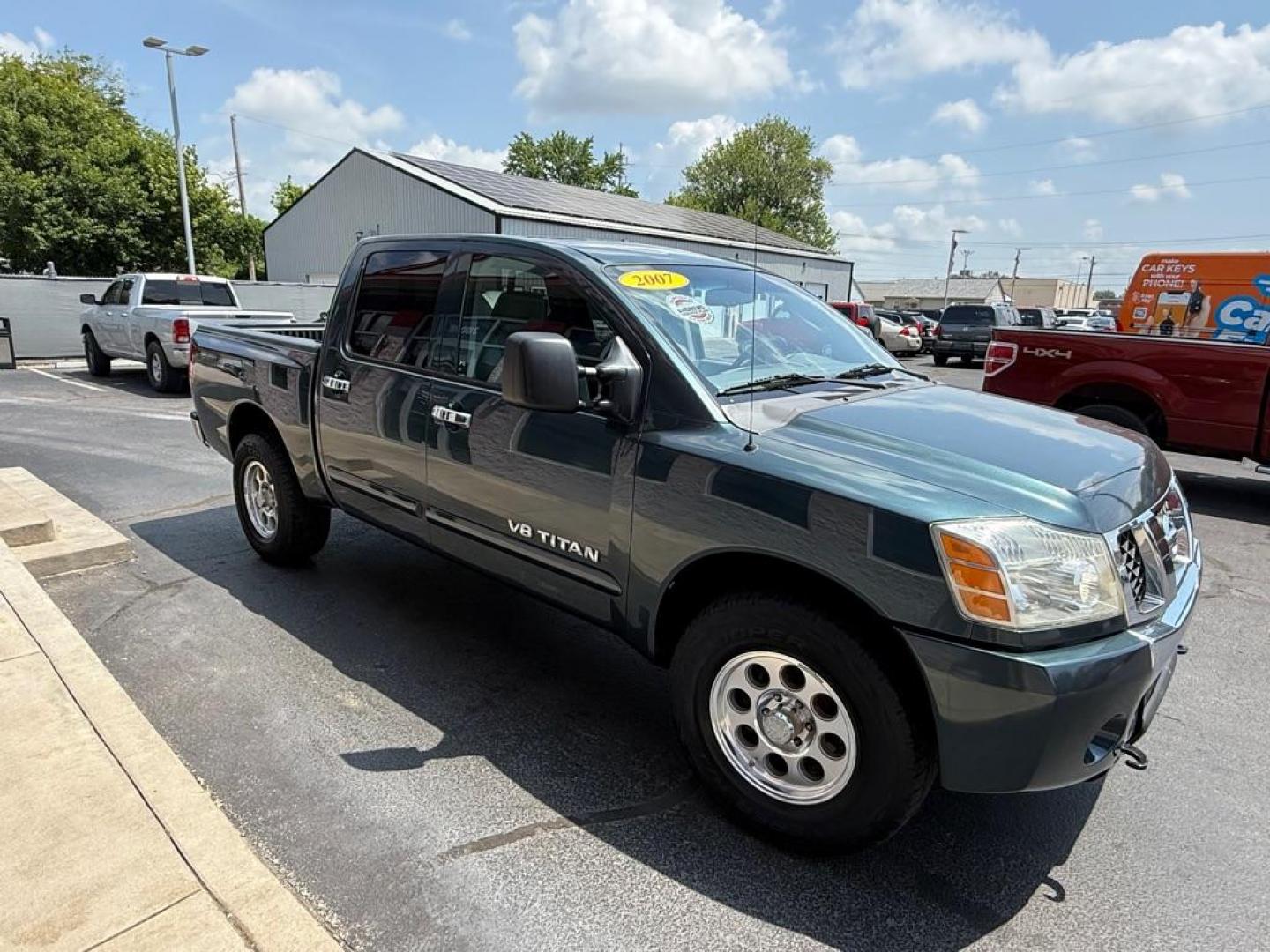 2007 GREEN NISSAN TITAN XE (1N6AA07B47N) with an 5.6L engine, Automatic transmission, located at 3100 Covert Avenue, Evansville, IN, 47714, (812) 473-4492, 37.955418, -87.512238 - Photo#2