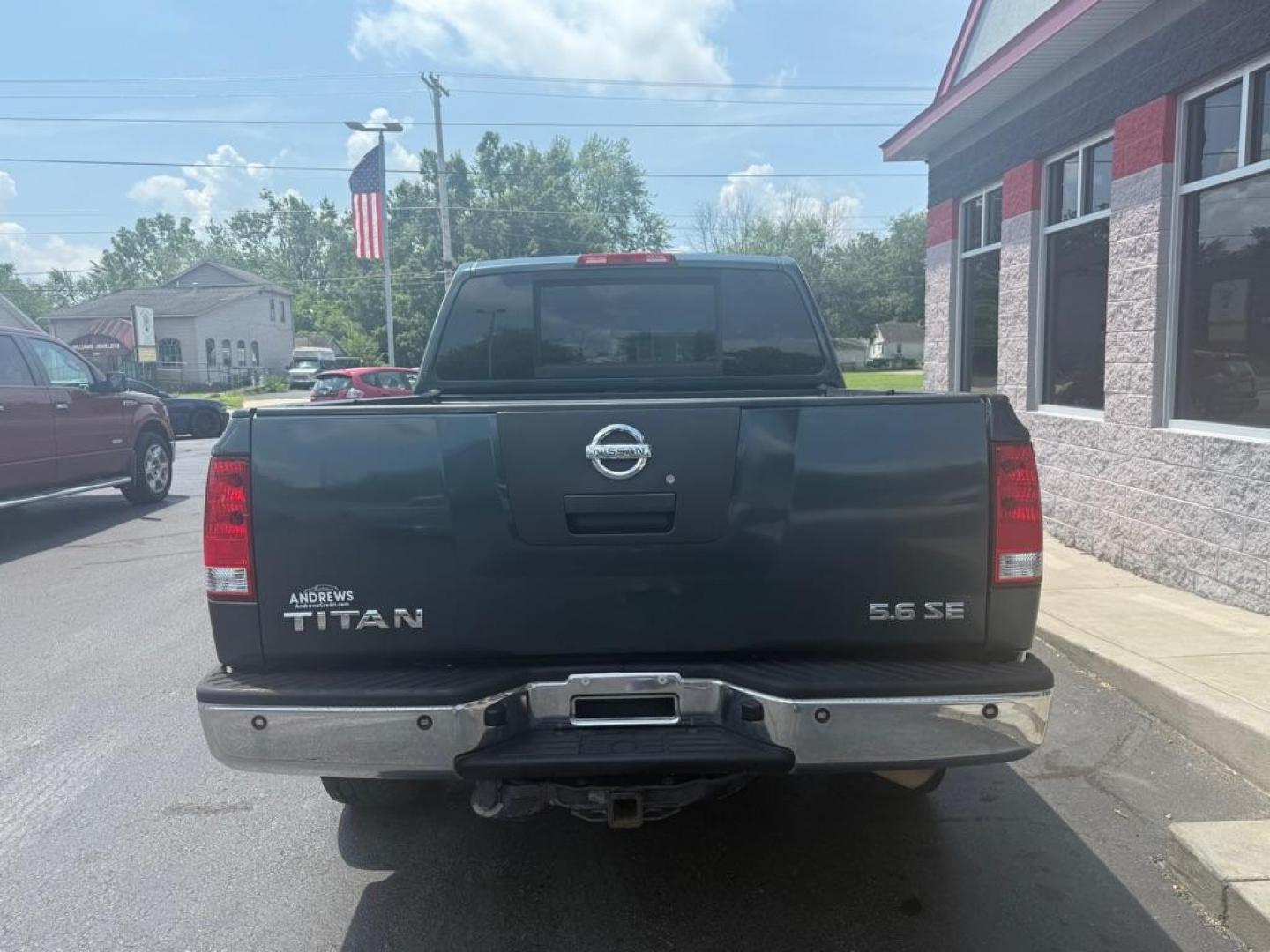 2007 GREEN NISSAN TITAN XE (1N6AA07B47N) with an 5.6L engine, Automatic transmission, located at 3100 Covert Avenue, Evansville, IN, 47714, (812) 473-4492, 37.955418, -87.512238 - Photo#3