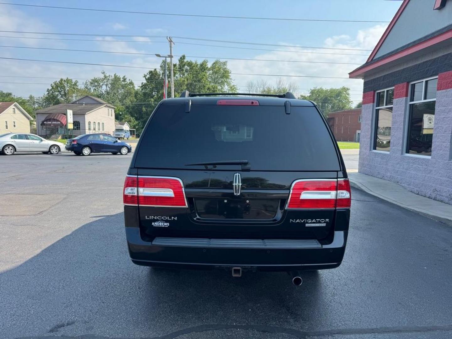 2014 BLACK LINCOLN NAVIGATOR L (5LMJJ3J52EE) with an 5.4L engine, Automatic transmission, located at 3100 Covert Avenue, Evansville, IN, 47714, (812) 473-4492, 37.955418, -87.512238 - Photo#3
