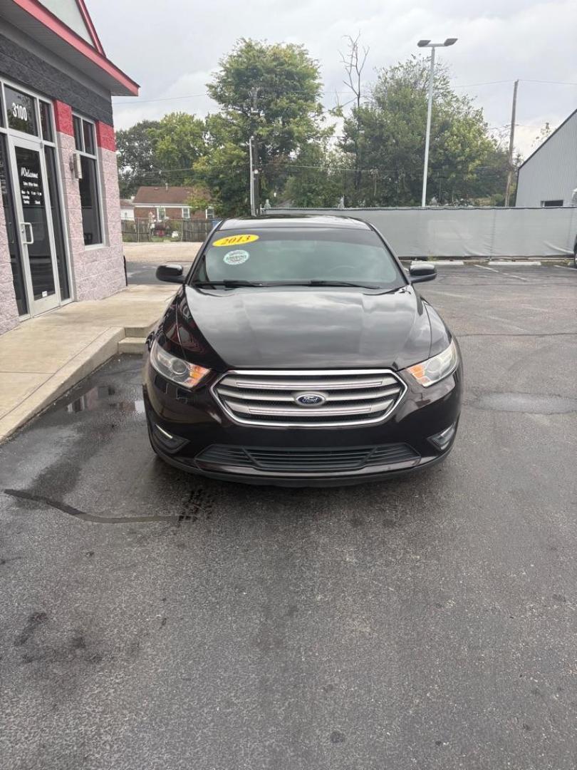 2013 BLACK FORD TAURUS SEL (1FAHP2E82DG) with an 3.5L engine, Automatic transmission, located at 3100 Covert Avenue, Evansville, IN, 47714, (812) 473-4492, 37.955418, -87.512238 - Photo#1