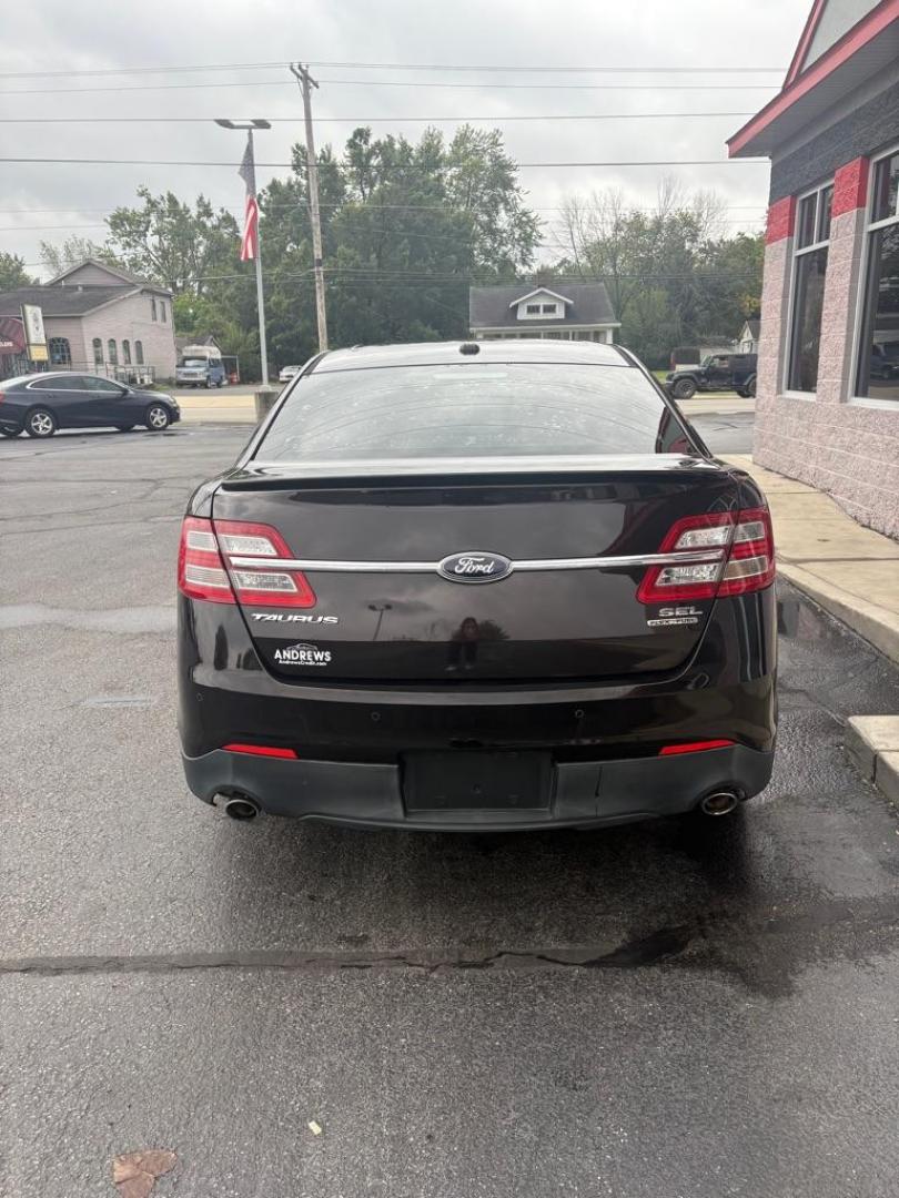 2013 BLACK FORD TAURUS SEL (1FAHP2E82DG) with an 3.5L engine, Automatic transmission, located at 3100 Covert Avenue, Evansville, IN, 47714, (812) 473-4492, 37.955418, -87.512238 - Photo#3
