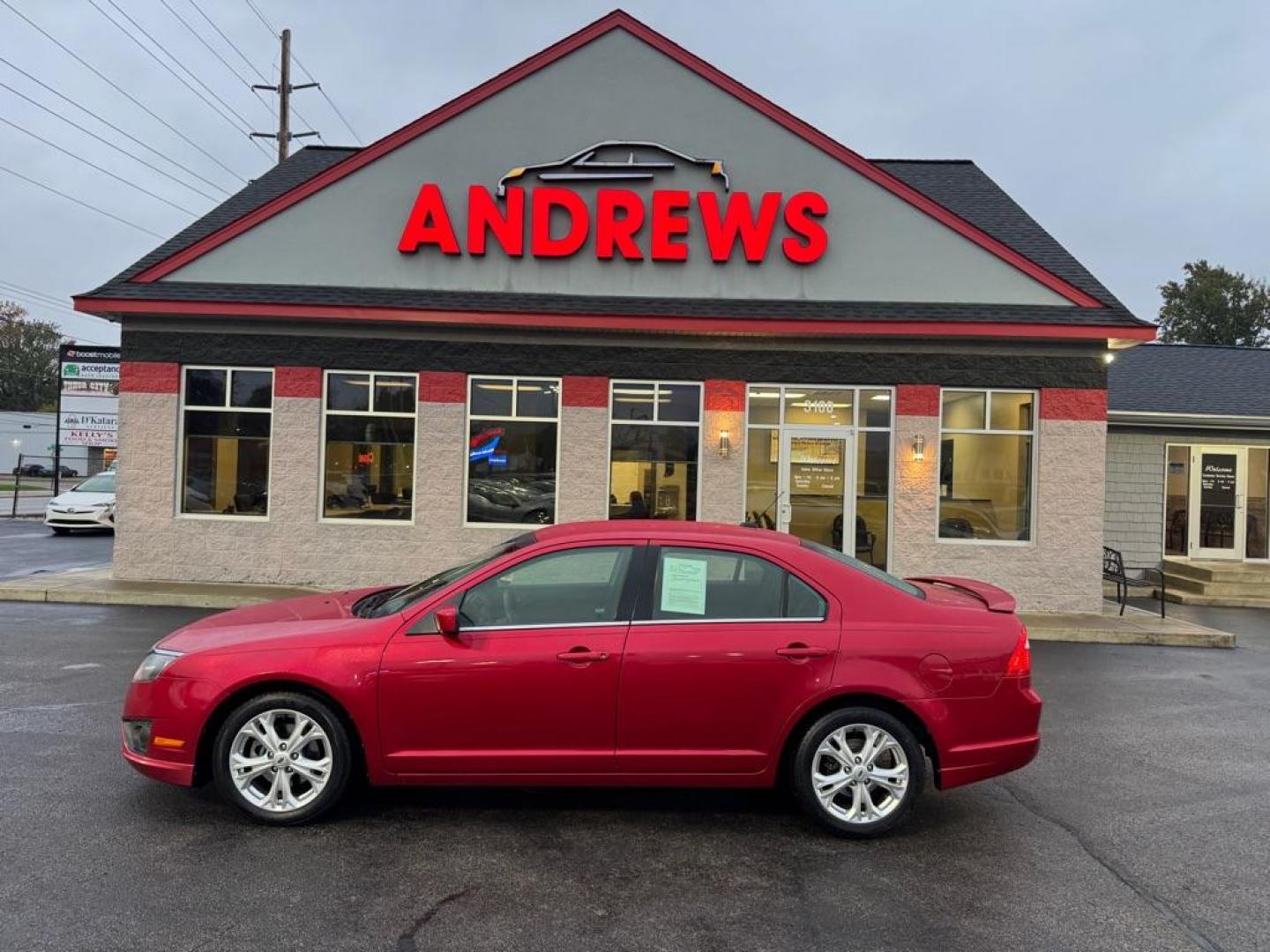 2012 RED FORD FUSION SE (3FAHP0HAXCR) with an 2.5L engine, Automatic transmission, located at 3100 Covert Avenue, Evansville, IN, 47714, (812) 473-4492, 37.955418, -87.512238 - Photo#0