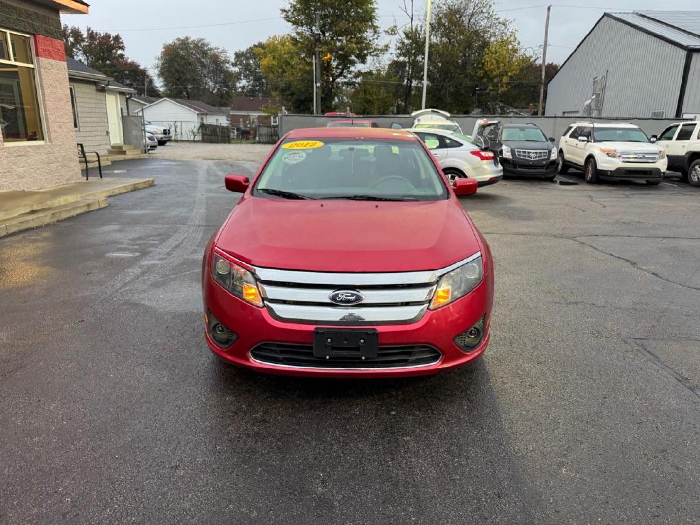 2012 RED FORD FUSION SE (3FAHP0HAXCR) with an 2.5L engine, Automatic transmission, located at 3100 Covert Avenue, Evansville, IN, 47714, (812) 473-4492, 37.955418, -87.512238 - Photo#1