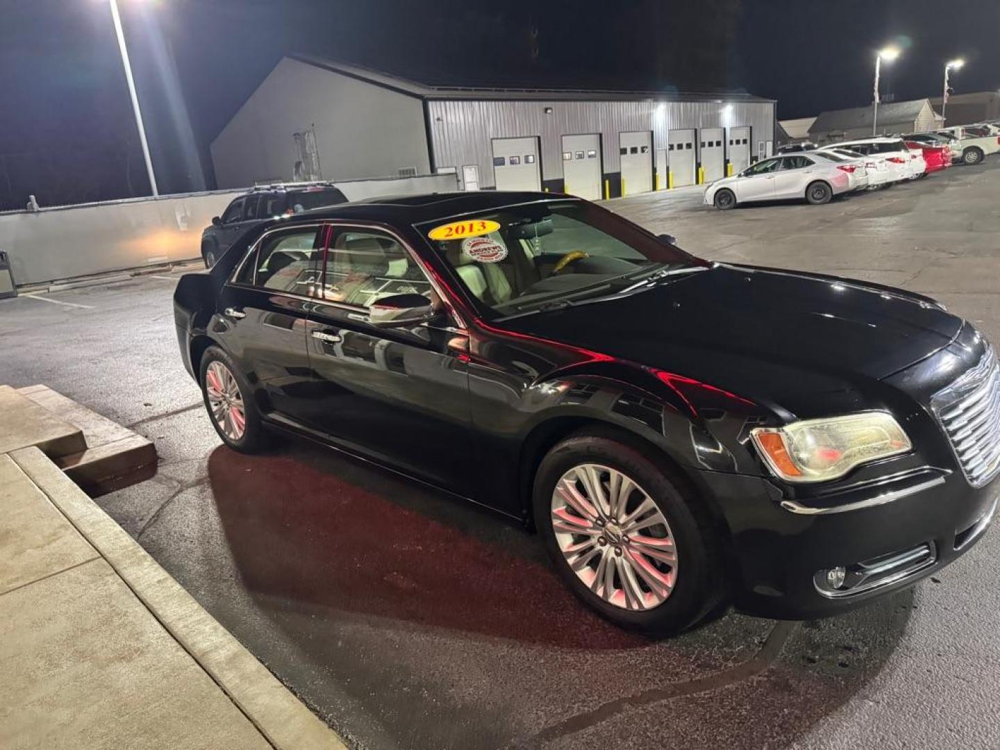 2013 BLACK CHRYSLER 300C (2C3CCAKG0DH) with an 3.6L engine, Automatic transmission, located at 3100 Covert Avenue, Evansville, IN, 47714, (812) 473-4492, 37.955418, -87.512238 - Photo#2