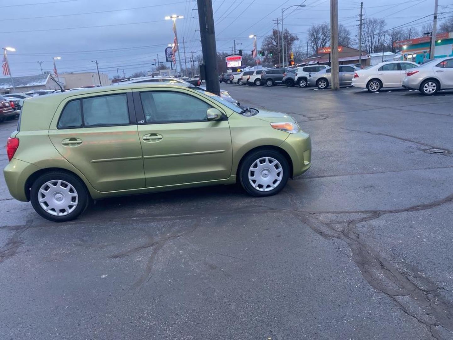 2009 GREEN SCION XD (JTKKU10439J) with an 1.8L engine, Automatic transmission, located at 3100 Covert Avenue, Evansville, IN, 47714, (812) 473-4492, 37.955418, -87.512238 - Photo#2